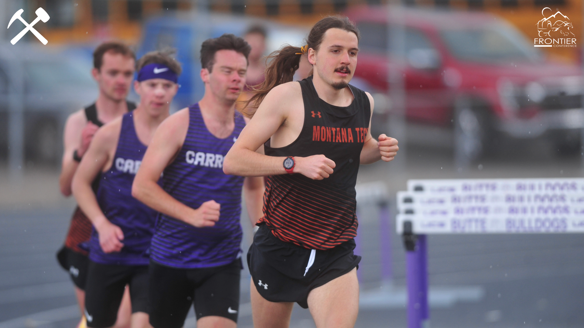Ben Zerr leads a pack of runners in a distance track race