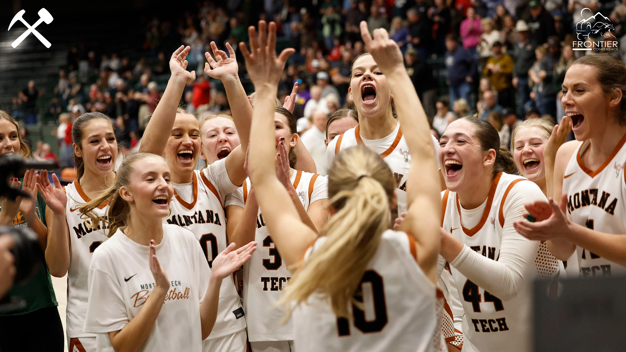 Montana Tech women's basketball players celebrate after a win in the Frontier Conference tournament