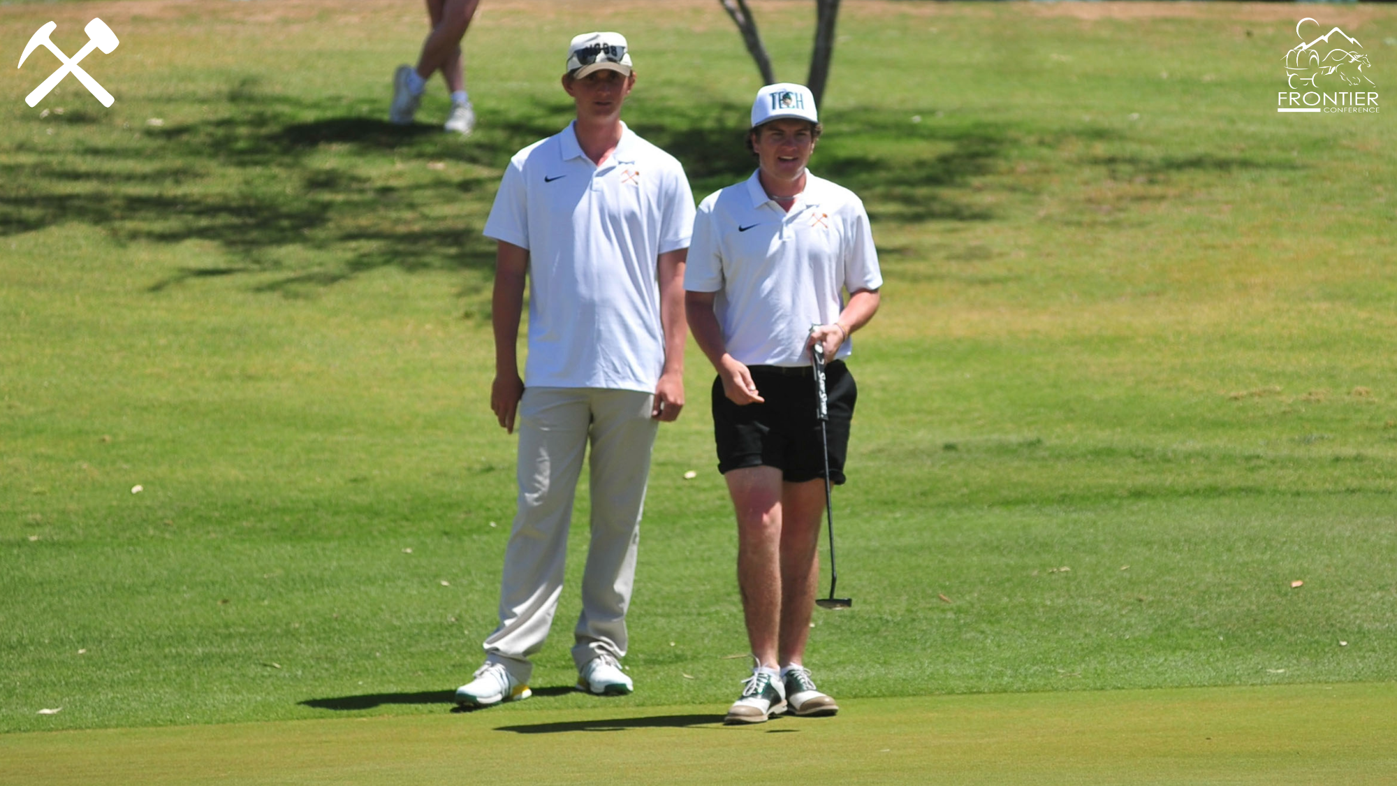 Montana Tech men's golfers Joe McGreevey and Landon Olson discuss a putt during a tournament