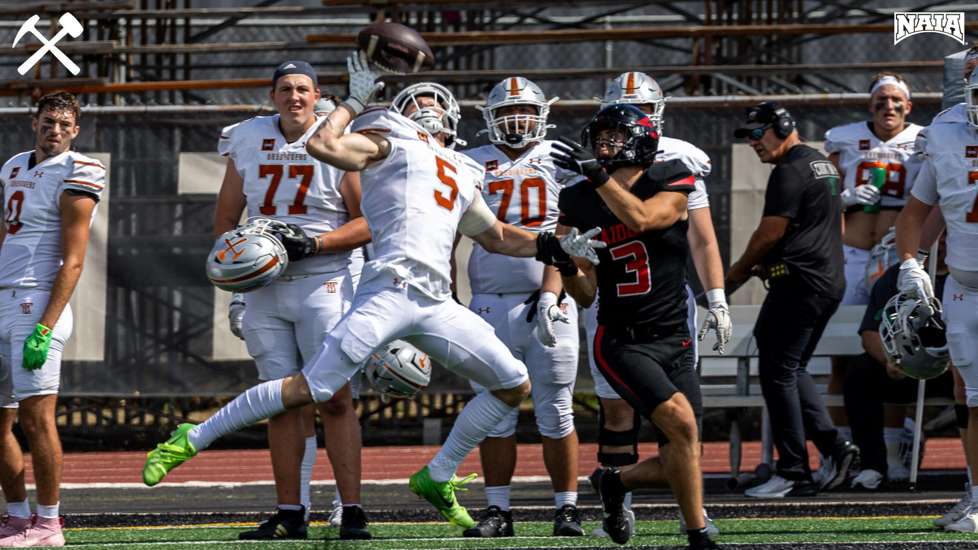Christian Hansen jumps to break up a pass during a Montana Tech football game.
