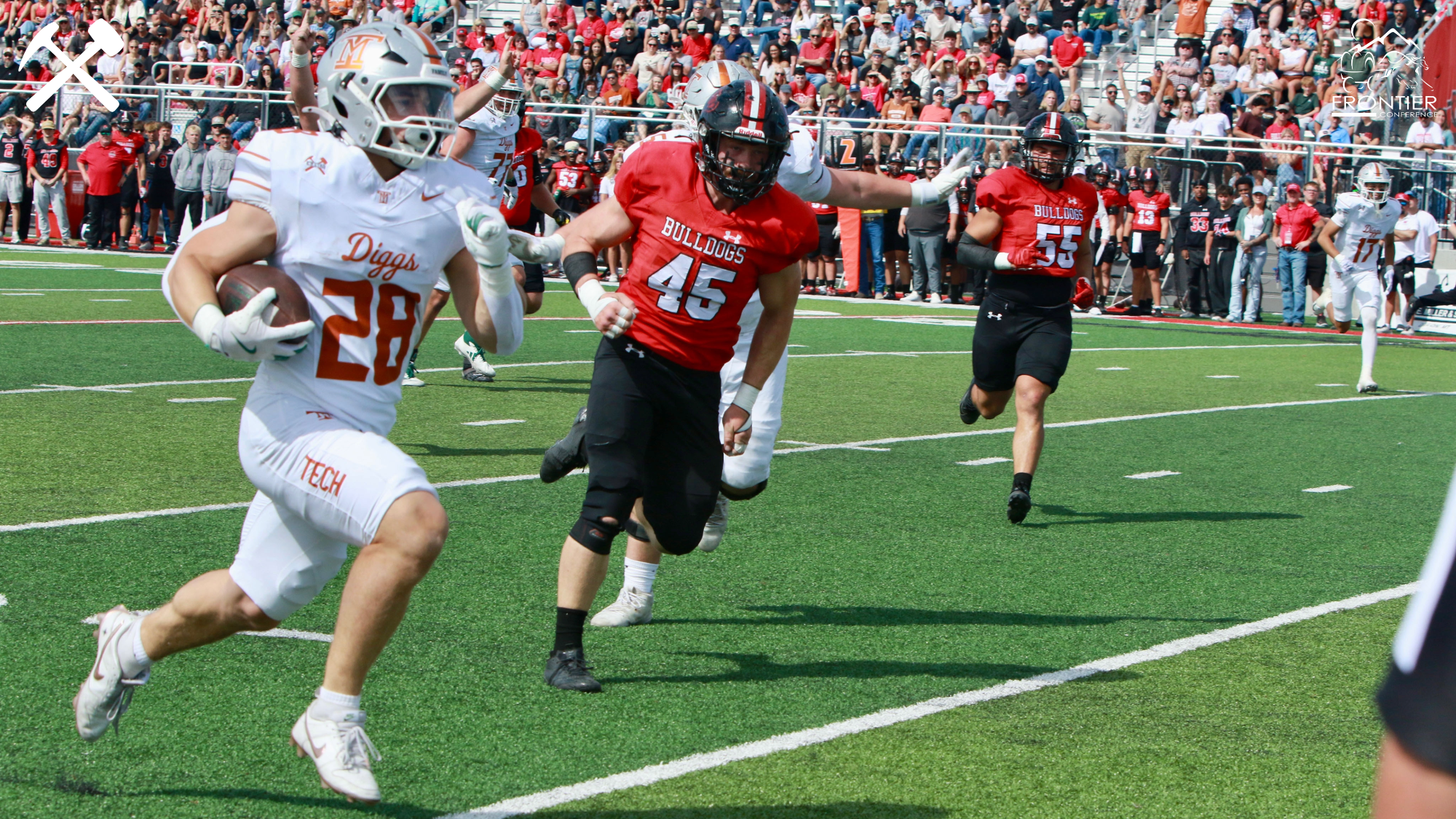 Gunnar Peterson races the Montana Western defense to the end zone in an Oredigger football game