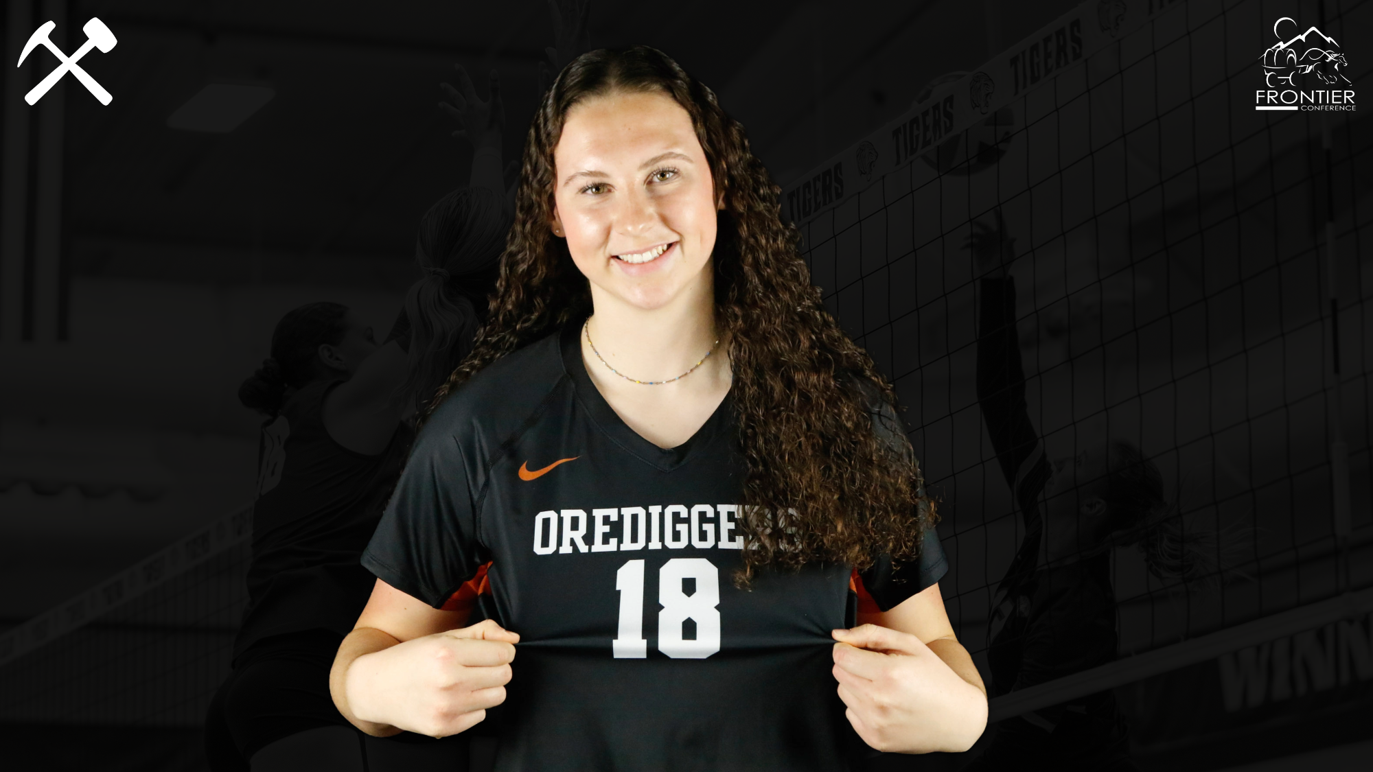 Madison Biery holds out her number 18 on a Montana Tech volleyball jersey