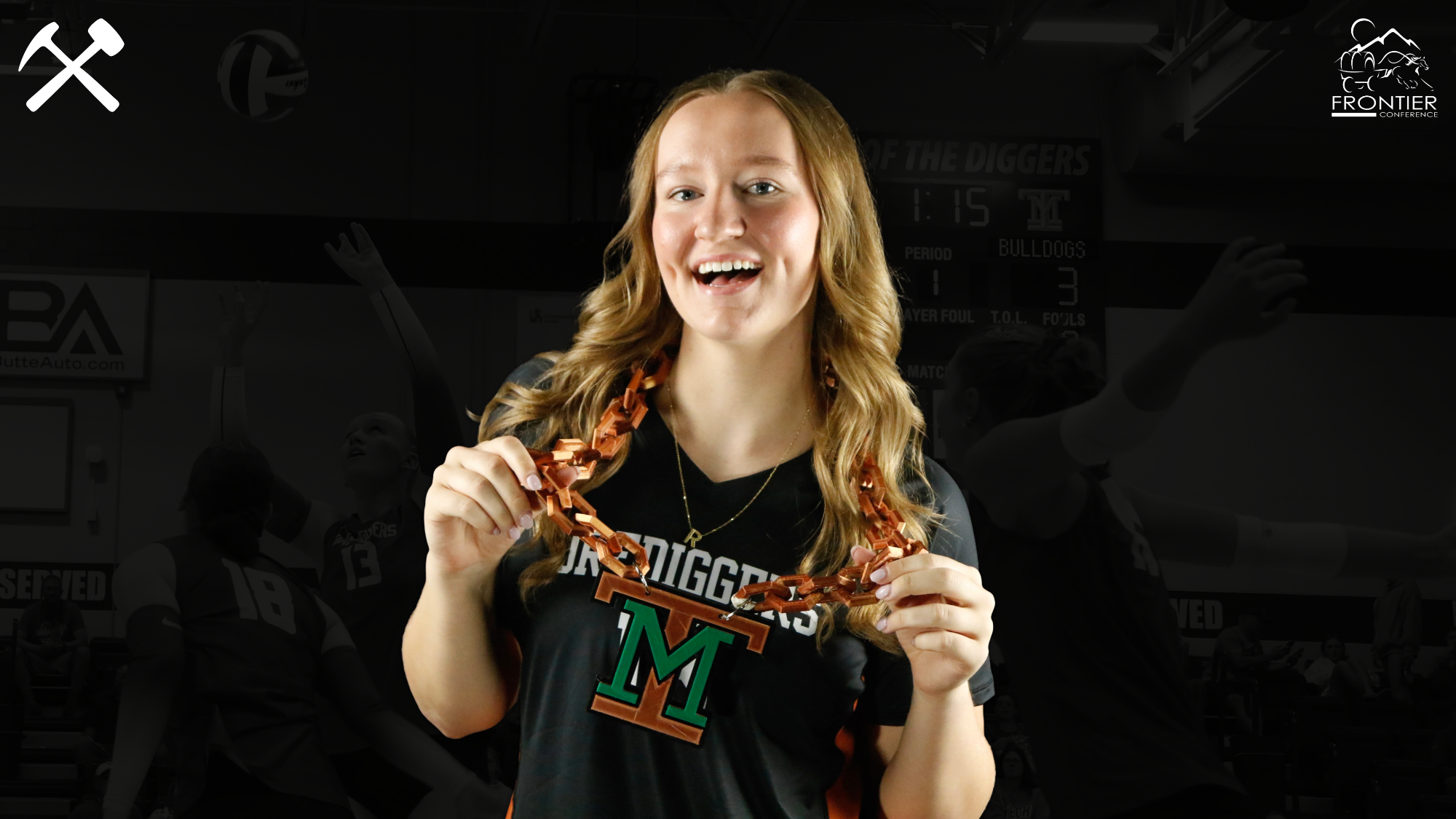 Rhys Layton in a Montana Tech volleyball uniform holding a copper and green Montana Tech chain around her neck