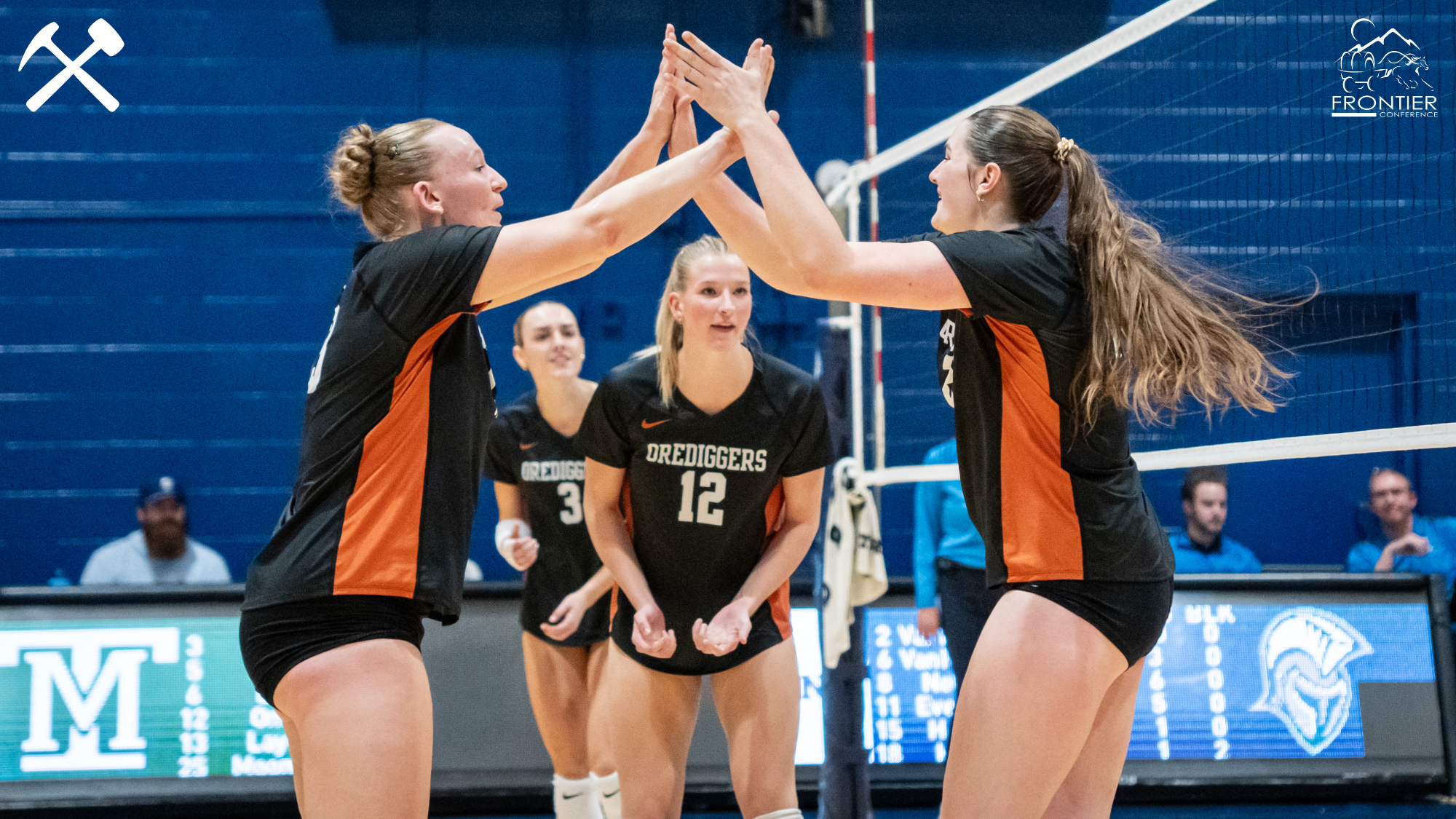 Montana Tech volleyball players celebrate a point in a win