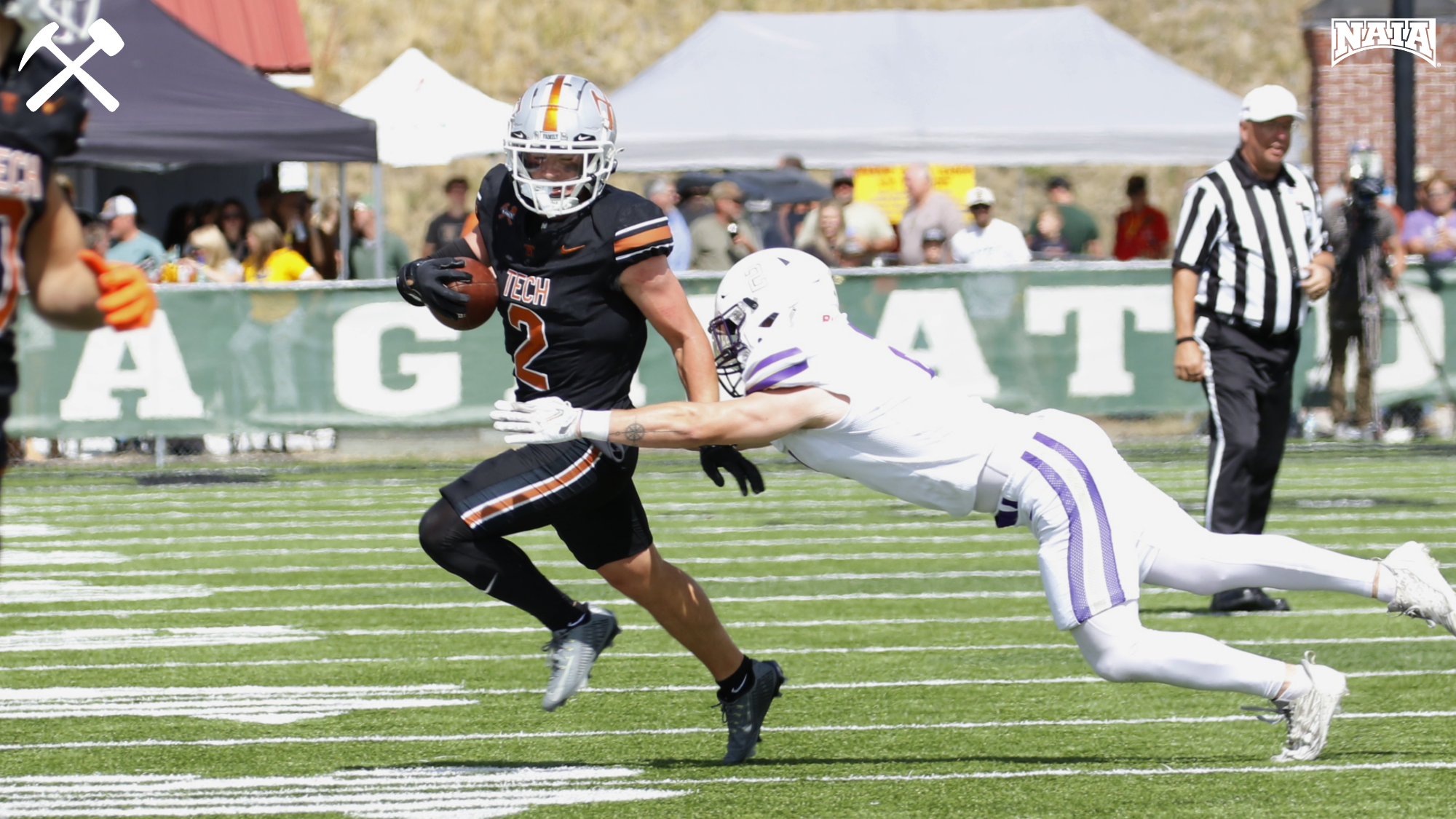 Levi Torgerson eludes a tackler during a Montana Tech football game