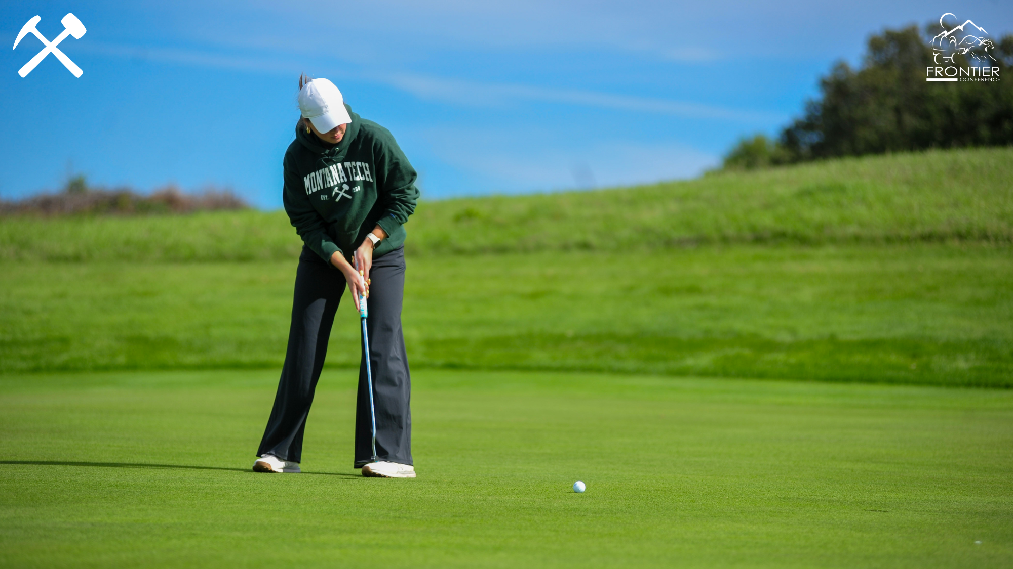 Keni Wade hits a putt during a Montana Tech golf round