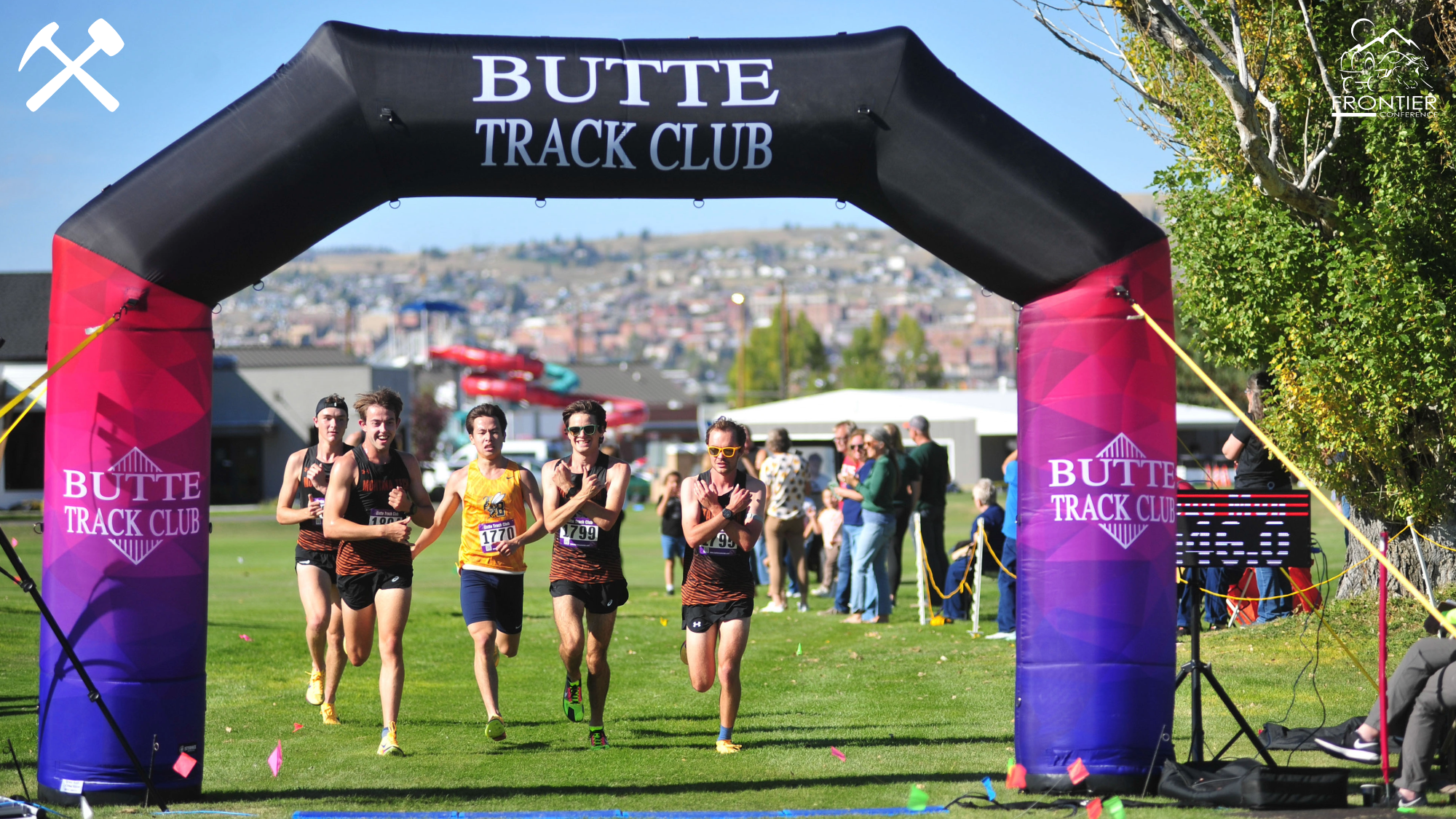 A pack of Montana Tech men's cross country runners cross the finish line