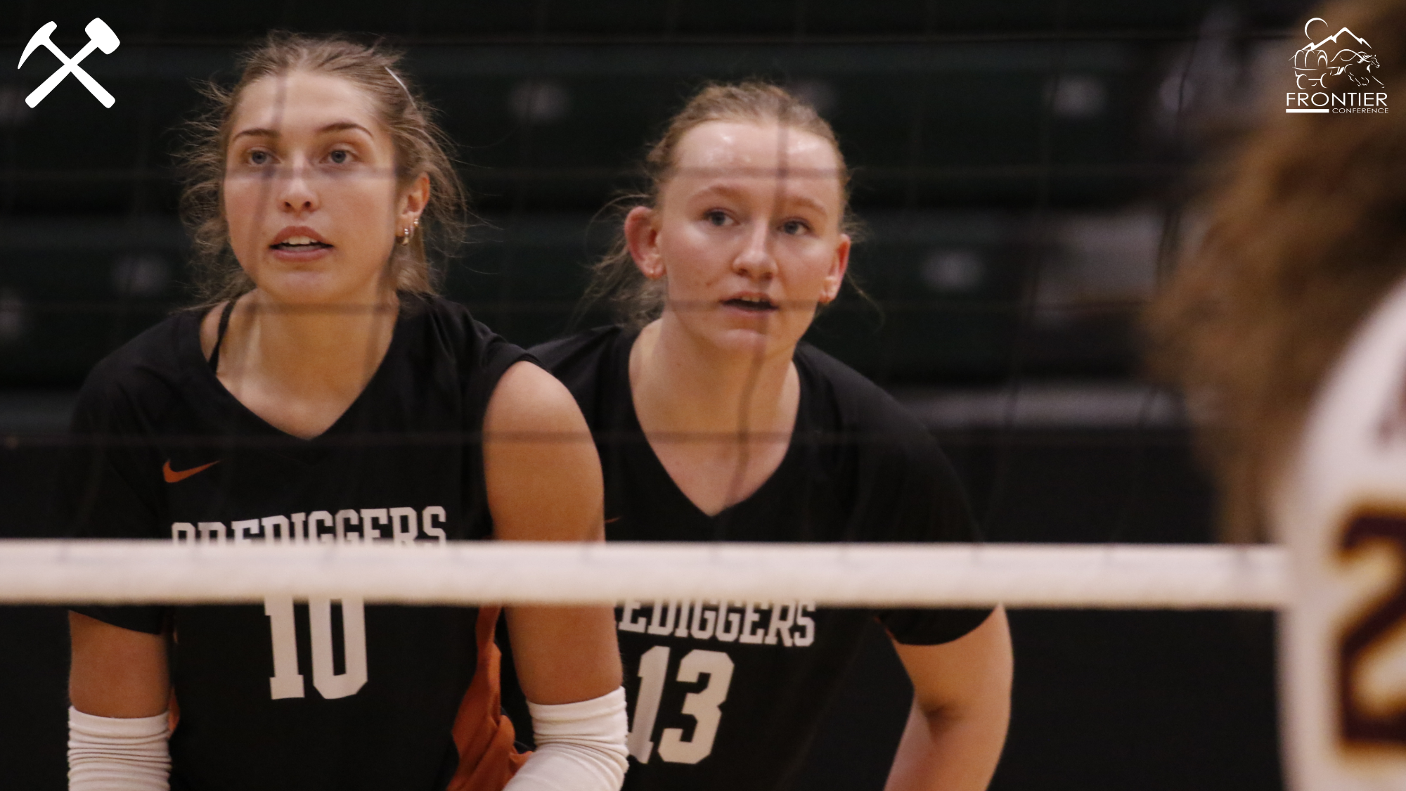 Rhys Layton and Payton Treadwell prepare to return a serve in a Montana Tech volleyball match