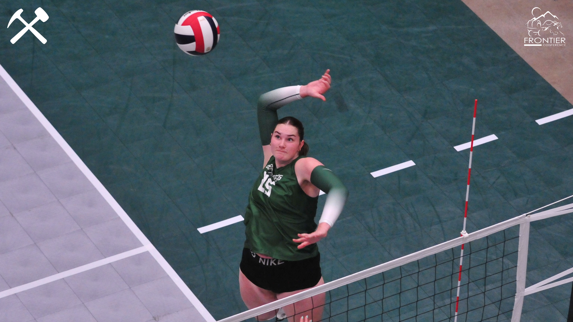 Halle Moomaw hitting a volleyball during a match