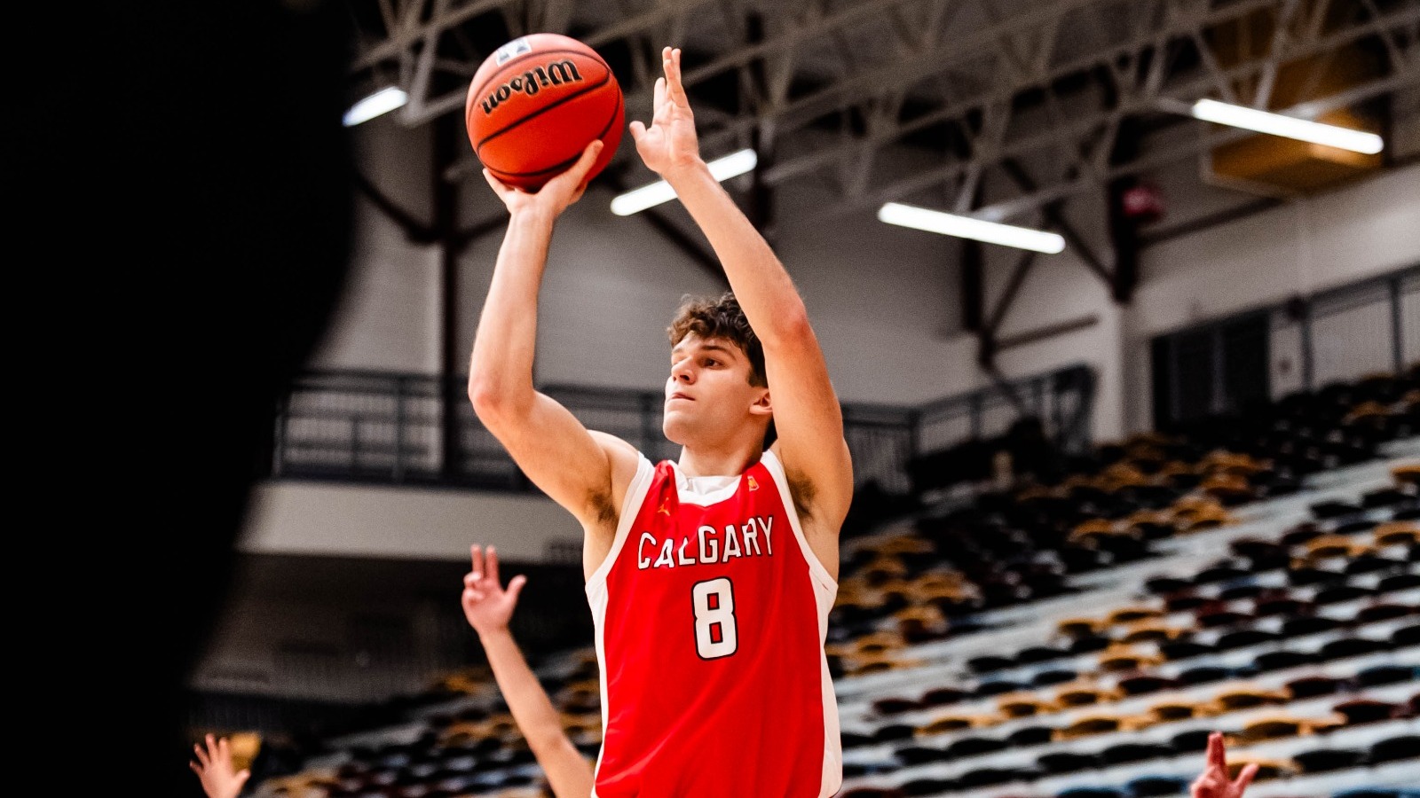 Daniels Baumanis takes a three-point shot