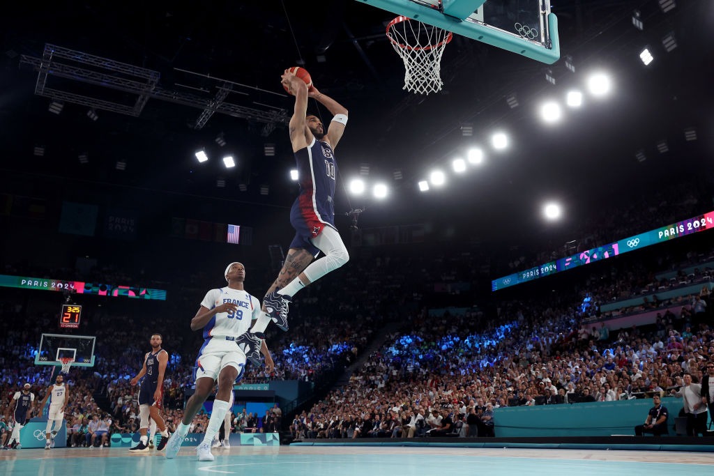 PARIS, FRANCE - AUGUST 10: (EDITORS NOTE: Image was captured using a remote camera) Jayson Tatum #10 of Team United States dunks the ball during the Men's Gold Medal game between Team France and Team United States on day fifteen of the Olympic Games Paris 2024 at Bercy Arena on August 10, 2024 in Paris, France. (Photo by Gregory Shamus/Getty Images)