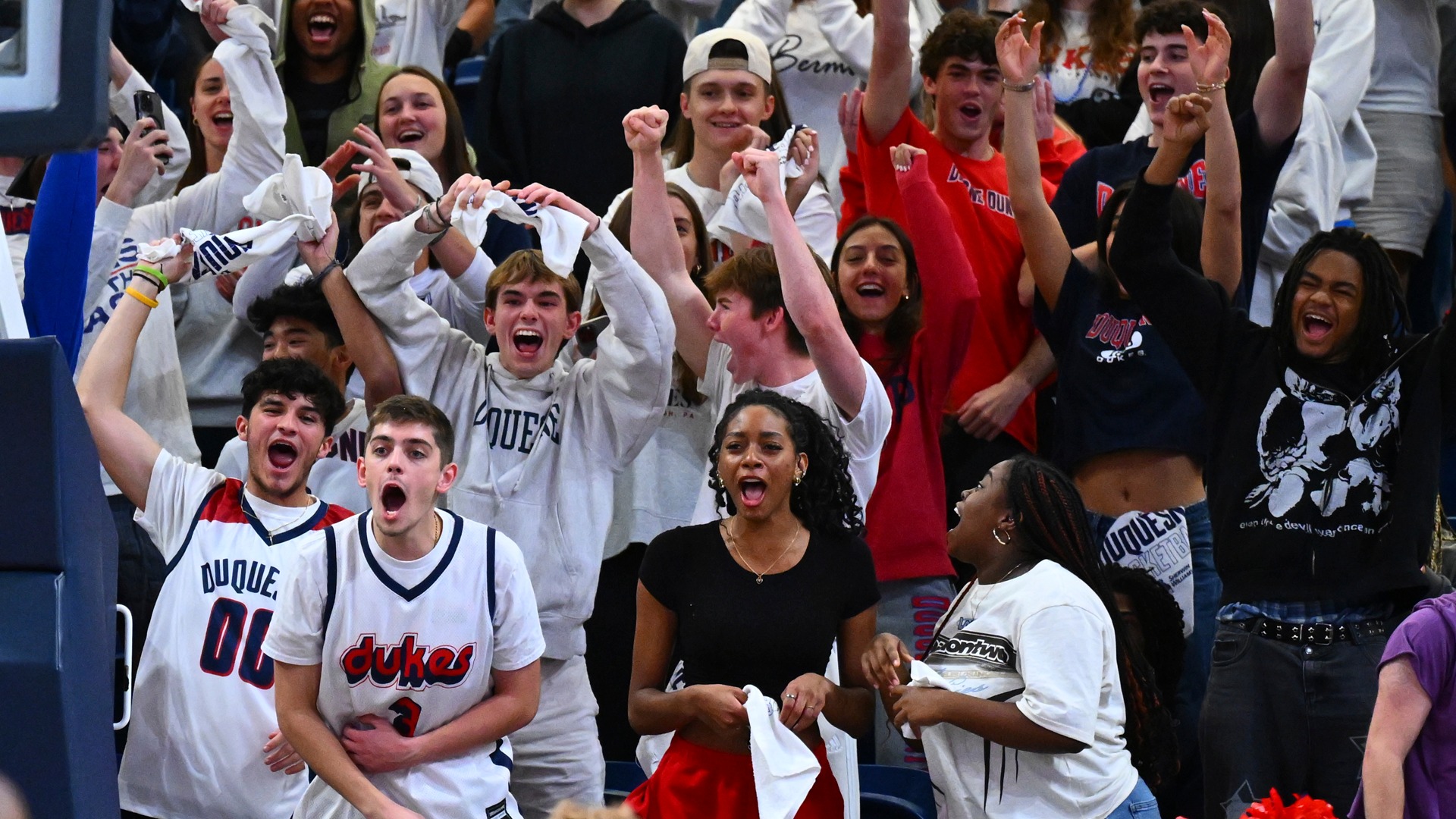 Duquesne student section at a men's basketball game during 2024-25 season.