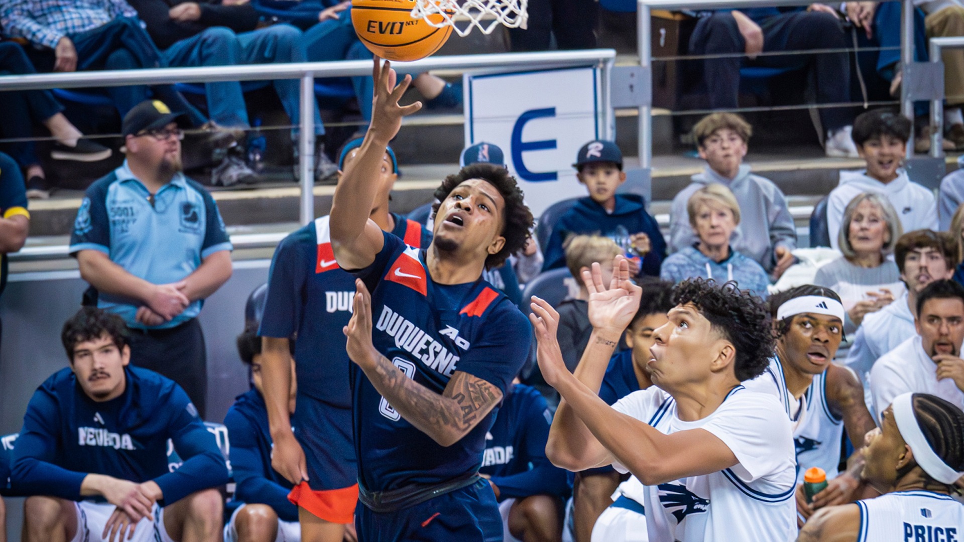 Jimmie Williams drives to the rack against Nevada at Lawlor Events Center.