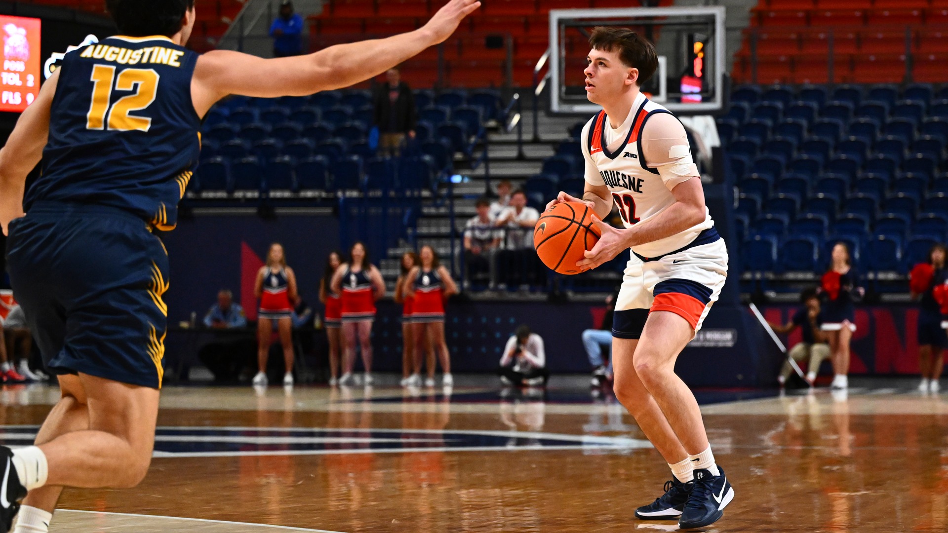 Ethan Anish gets set to take a three-pointer vs. Canisius at UPMC Cooper Fieldhouse.