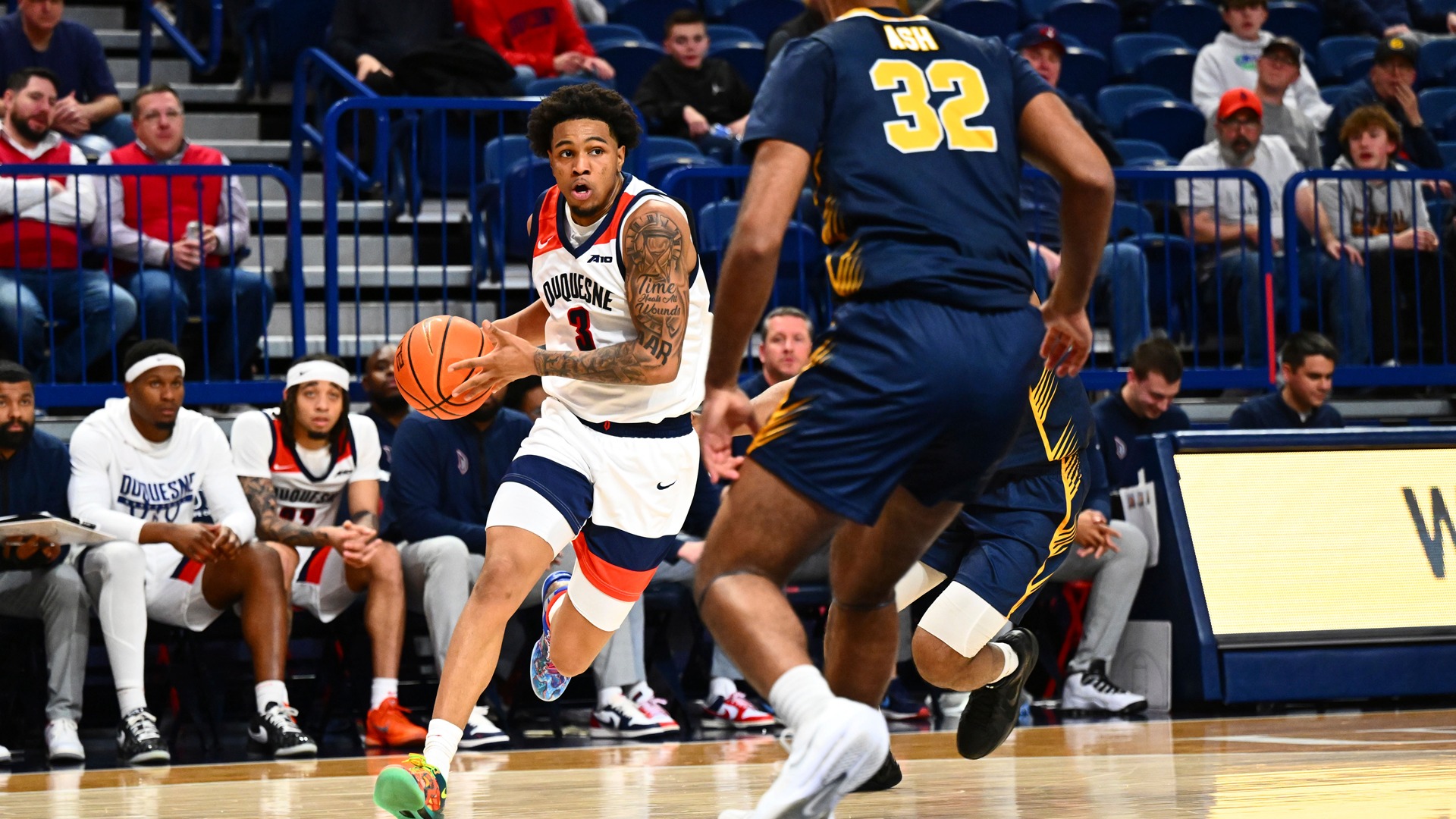 Jimmie Williams drives against Canisius at UPMC Cooper Fieldhouse.