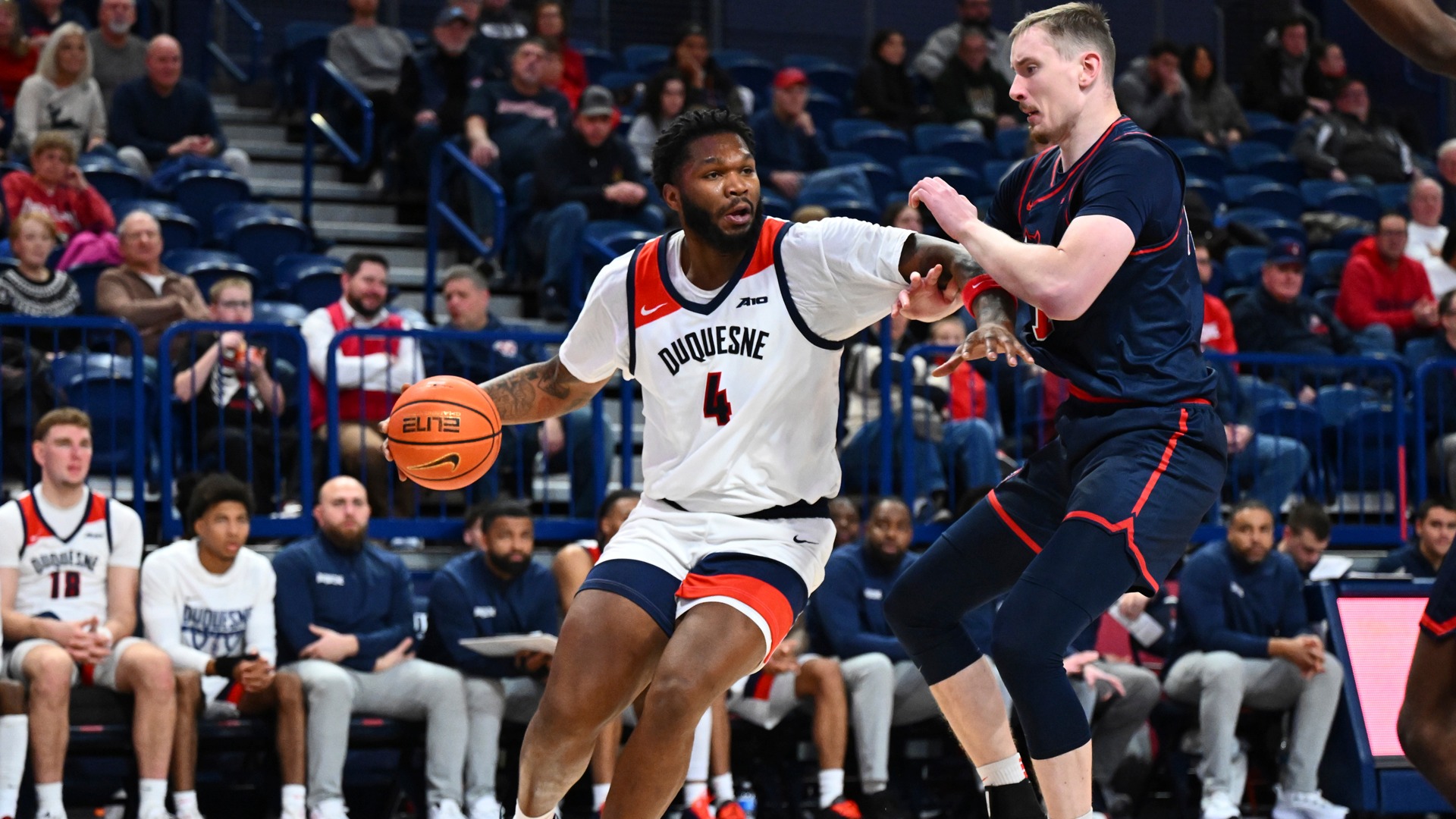 John Hugley IV drives in the second half vs. Stony Brook at UPMC Cooper Fieldhouse.
