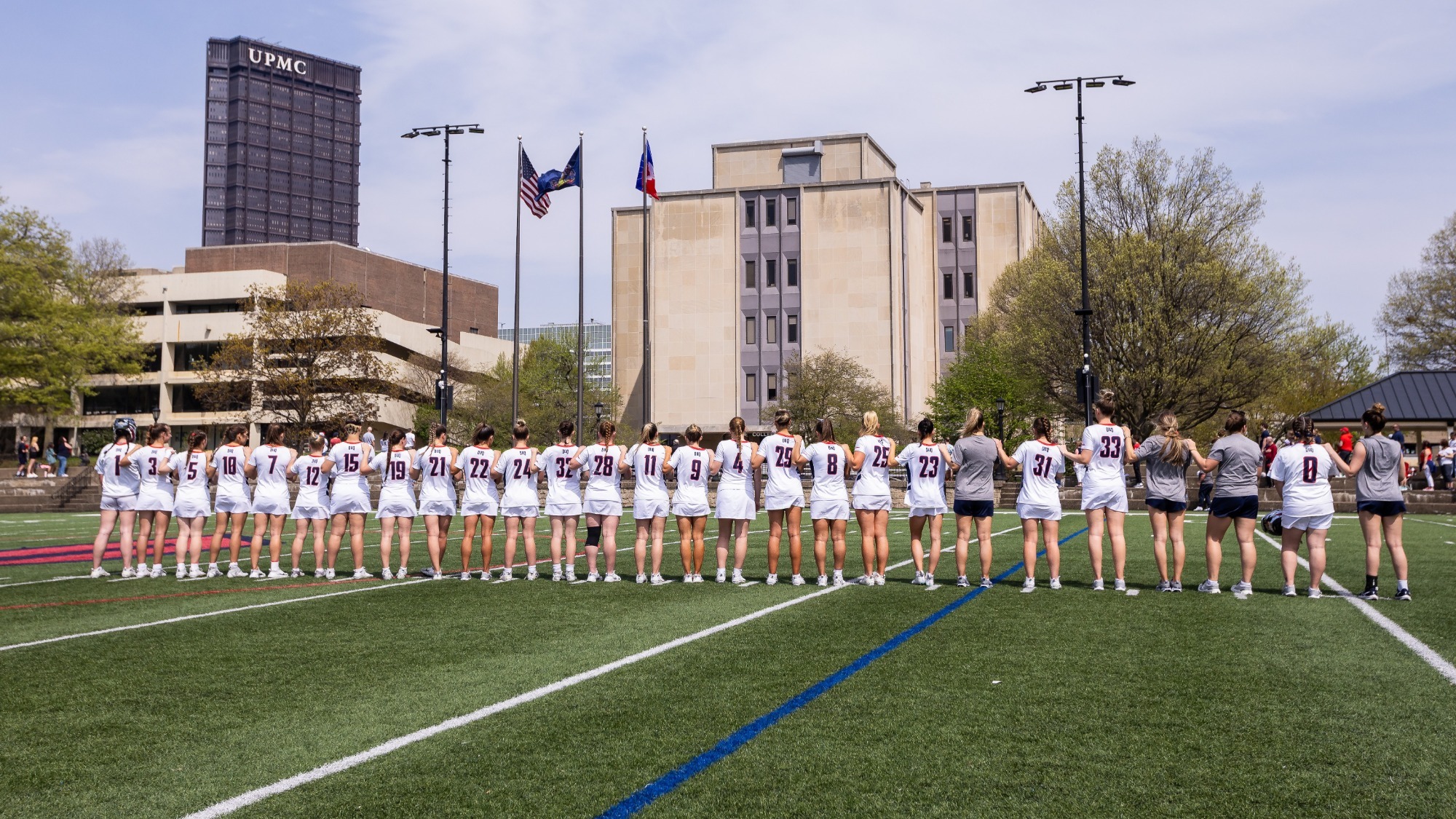 lacrosse team lines up for national anthem - spring 2025