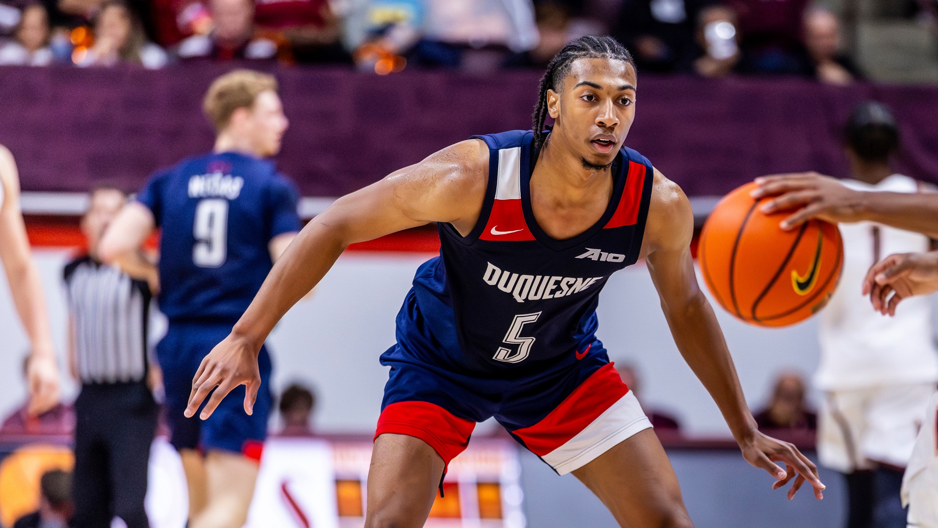 Cam Crawford defends at Virginia Tech during an exhibition game.