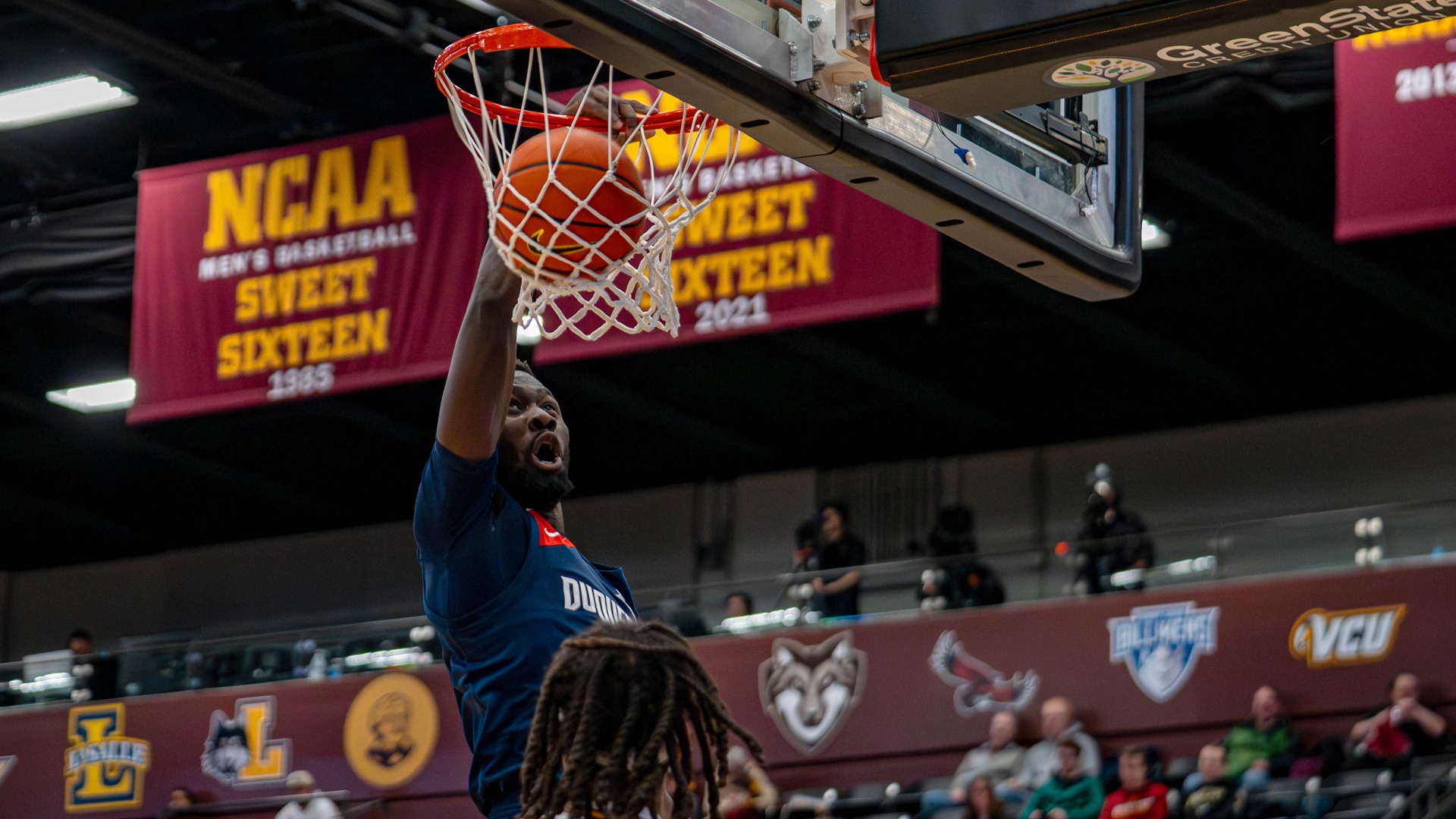 David Dixon dunks in the first half Saturday at Loyola Chicago.
