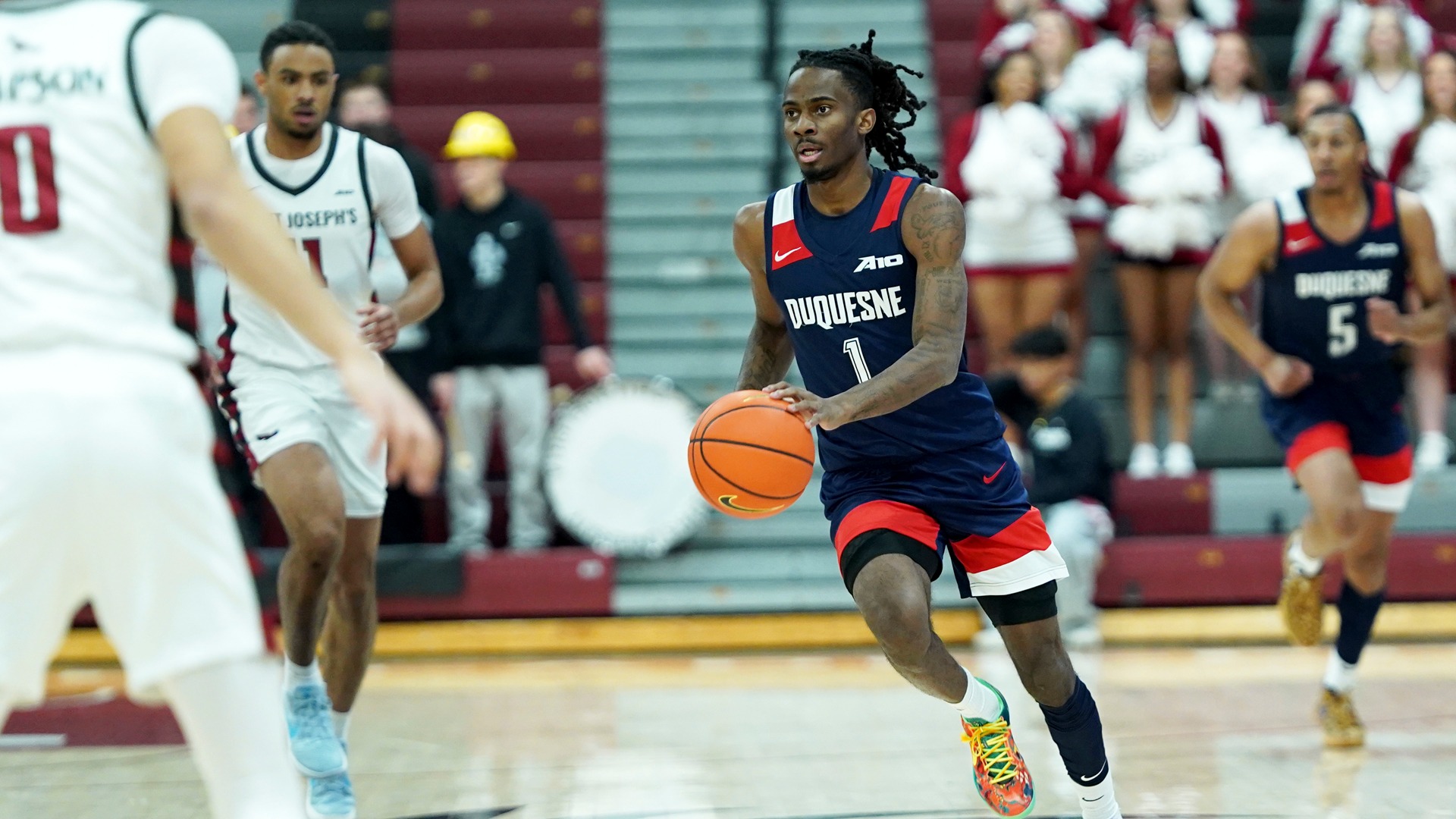 Tarence Guinyard drives in the open court Wednesday at Saint Joseph's.