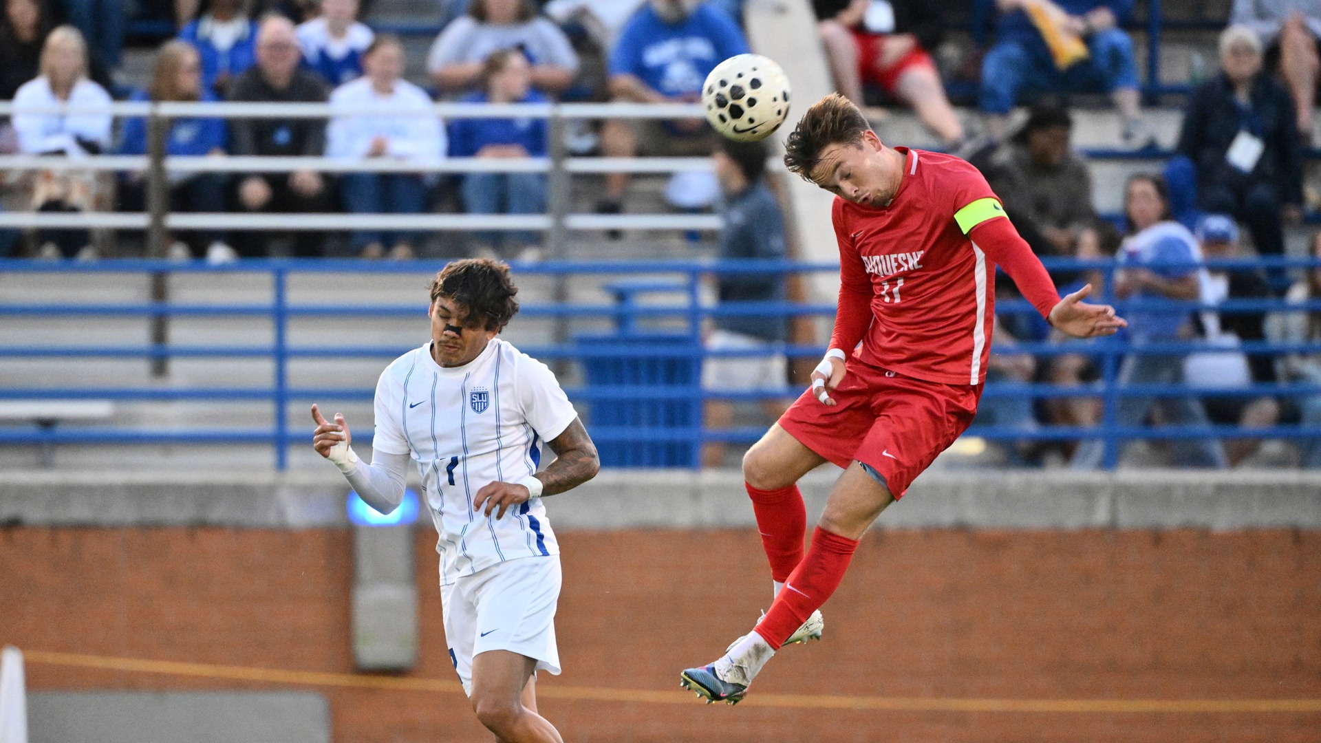 Jaxon Ervin with a header at Saint Louis.