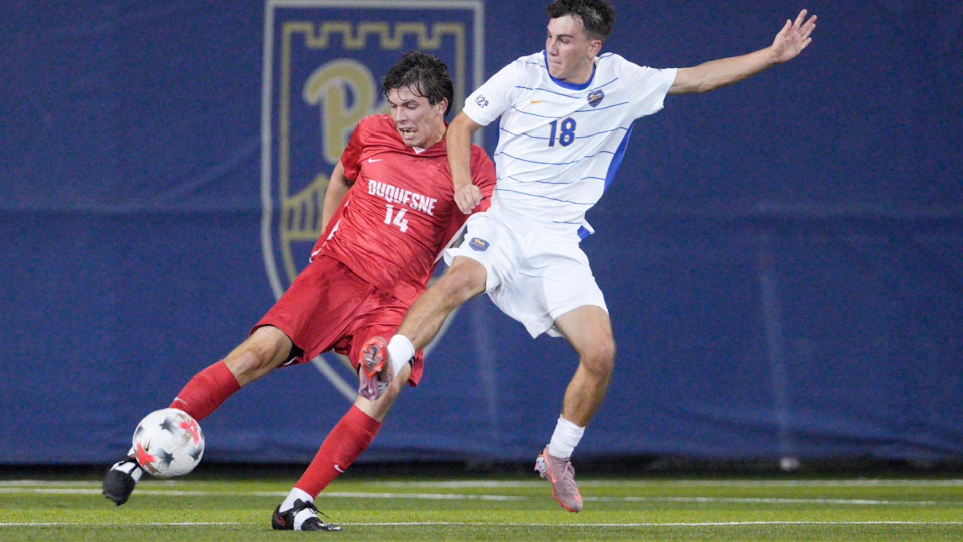 Dan Banks battles for the ball against Pitt at Ambrose Urbanic Field.