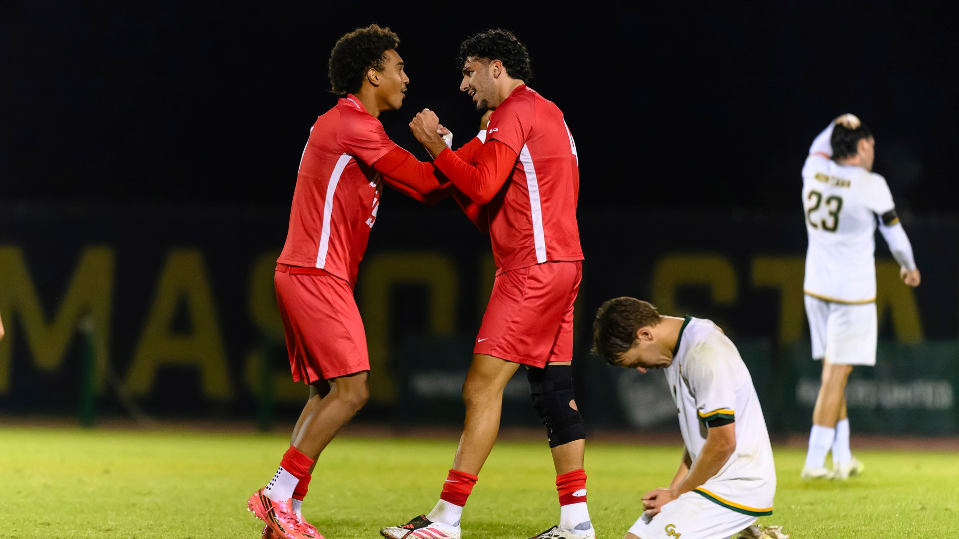 Cody Da & Ofek Sasson celebrate after Sasson scores game-winning goal at George Mason.