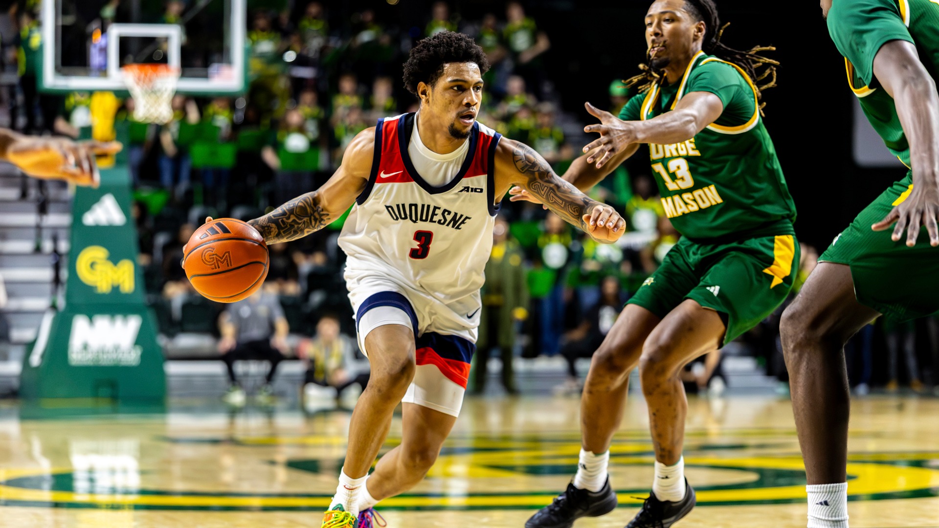 Jimmie Williams drives at George Mason.