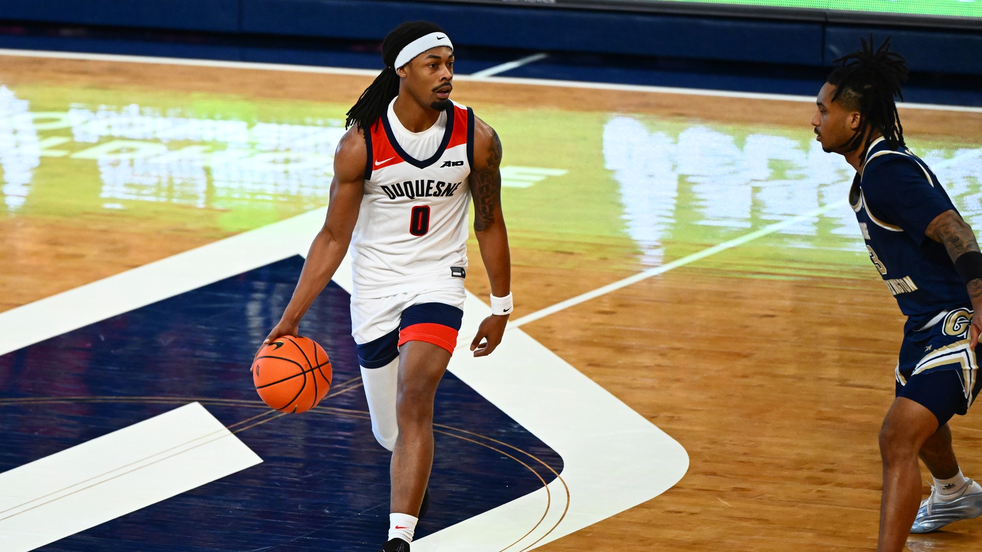 Brandon Hall brings the ball over midcourt against George Washington.