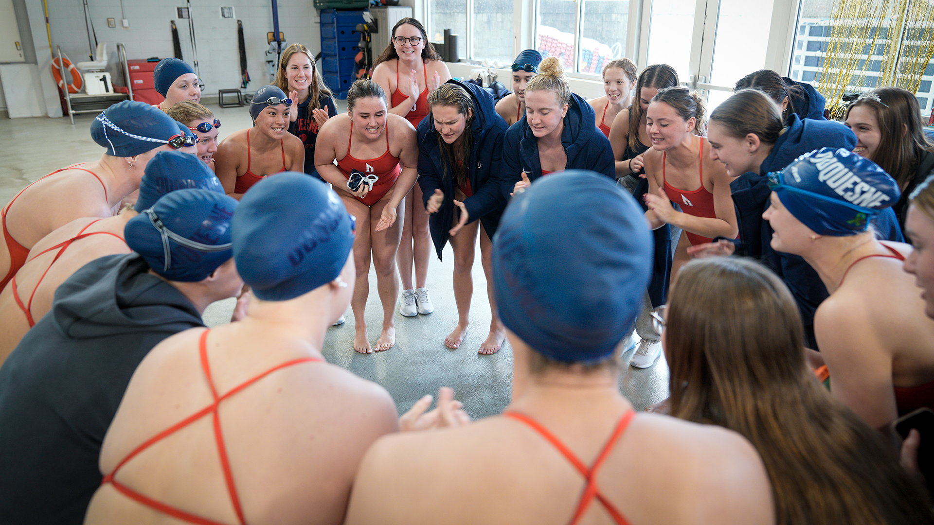 DUQ Swimming & Diving huddle