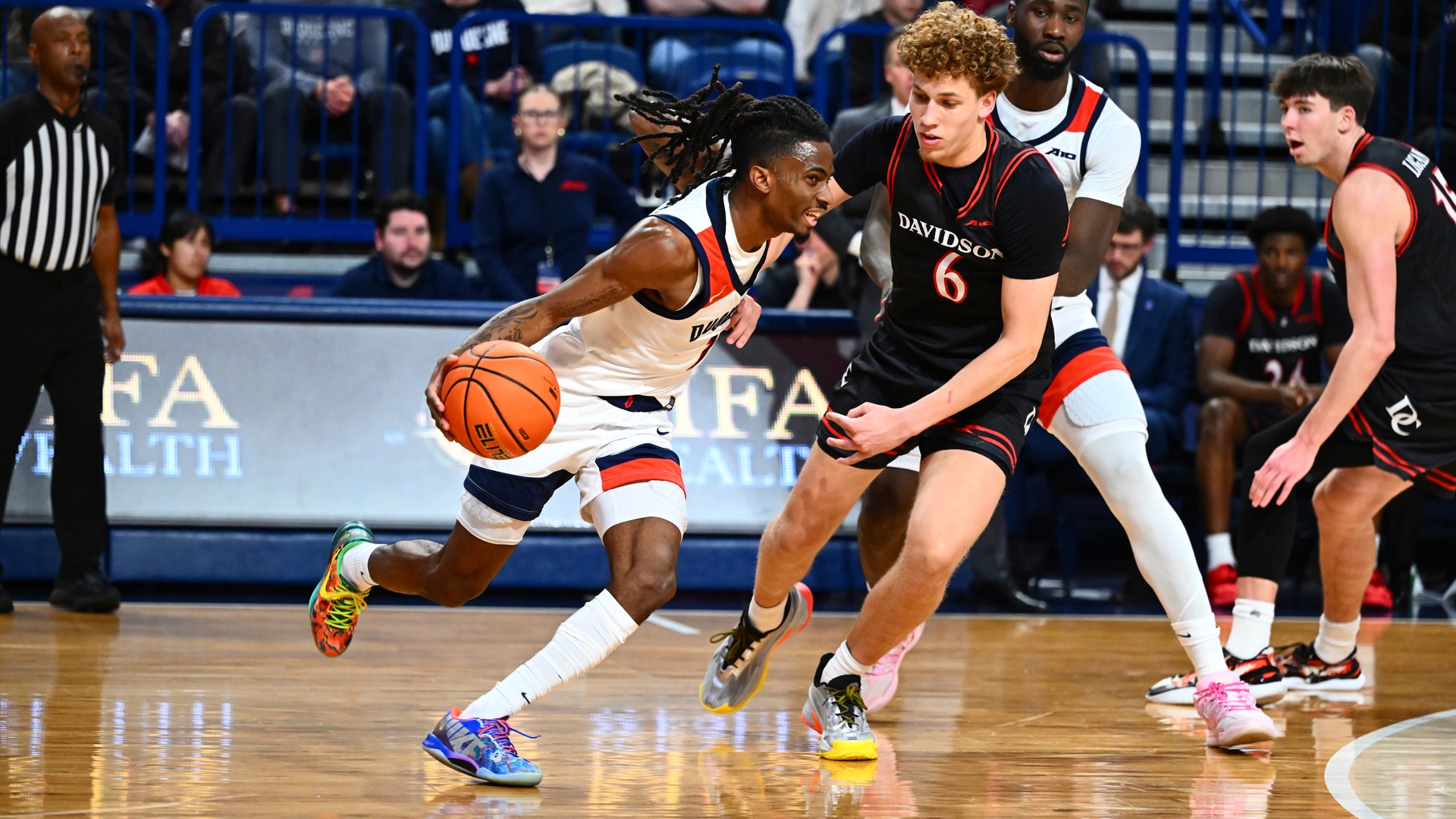 Tarence Guinyard drives in the first half vs. Davidson at UPMC Cooper Fieldhouse.