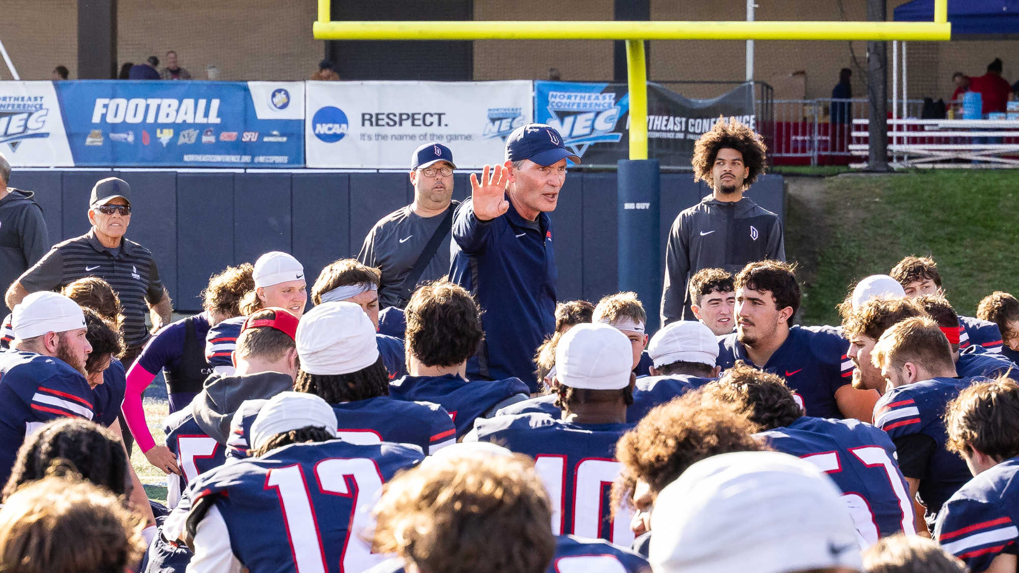 FB coach jerry schmitt talks to team postgame after homecoming win over SFU at Rooney Field in 2025