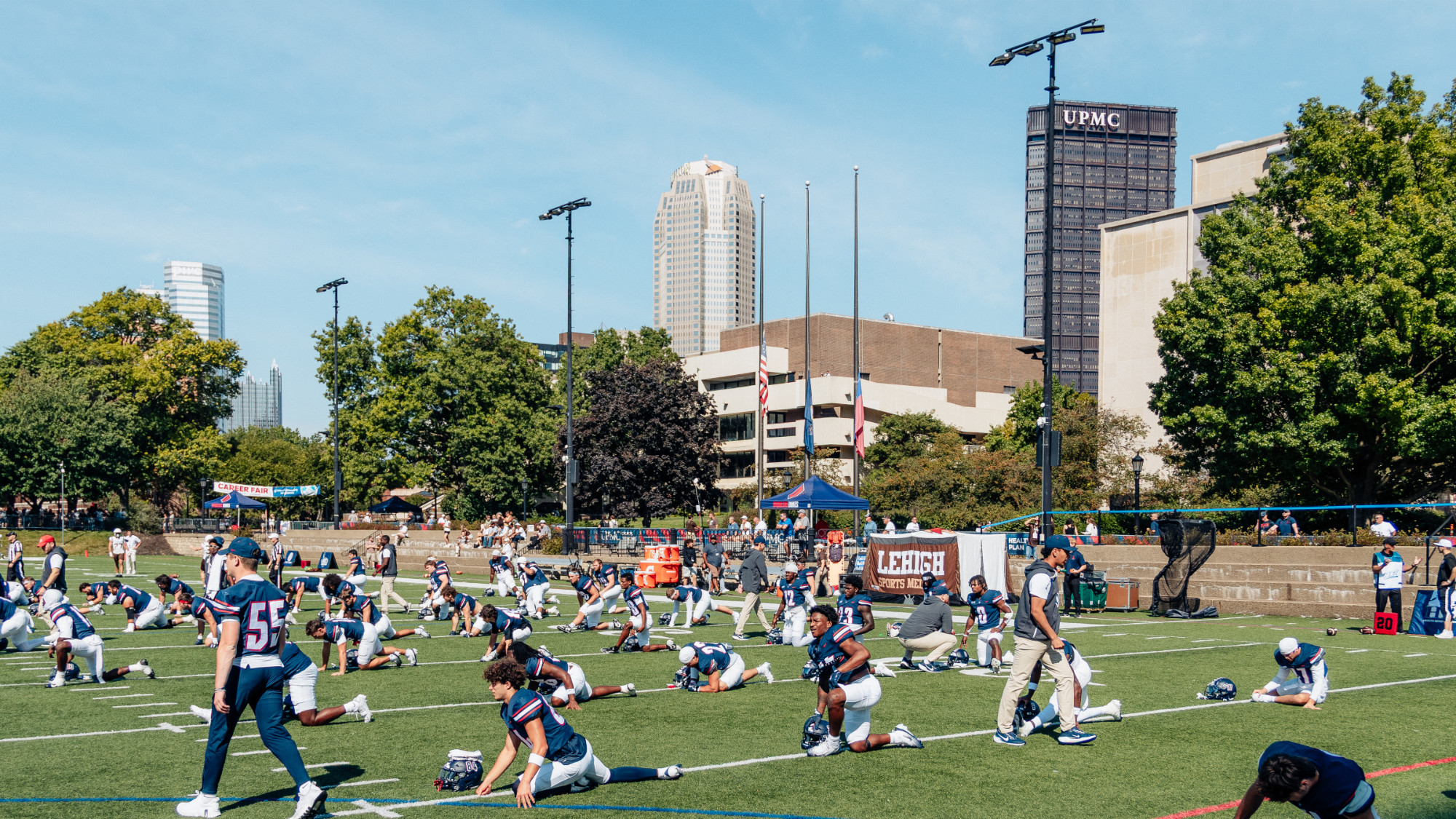 football team stretches vs. Lehigh 2025