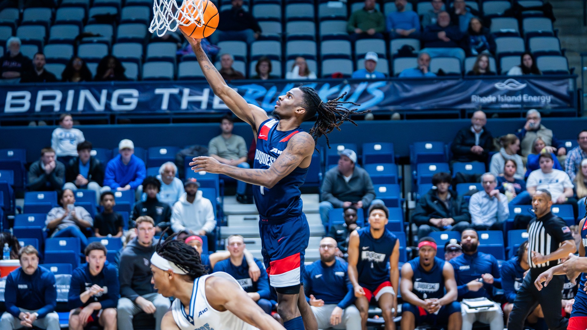 Tarence Guinyard at the rim at Rhode Island.