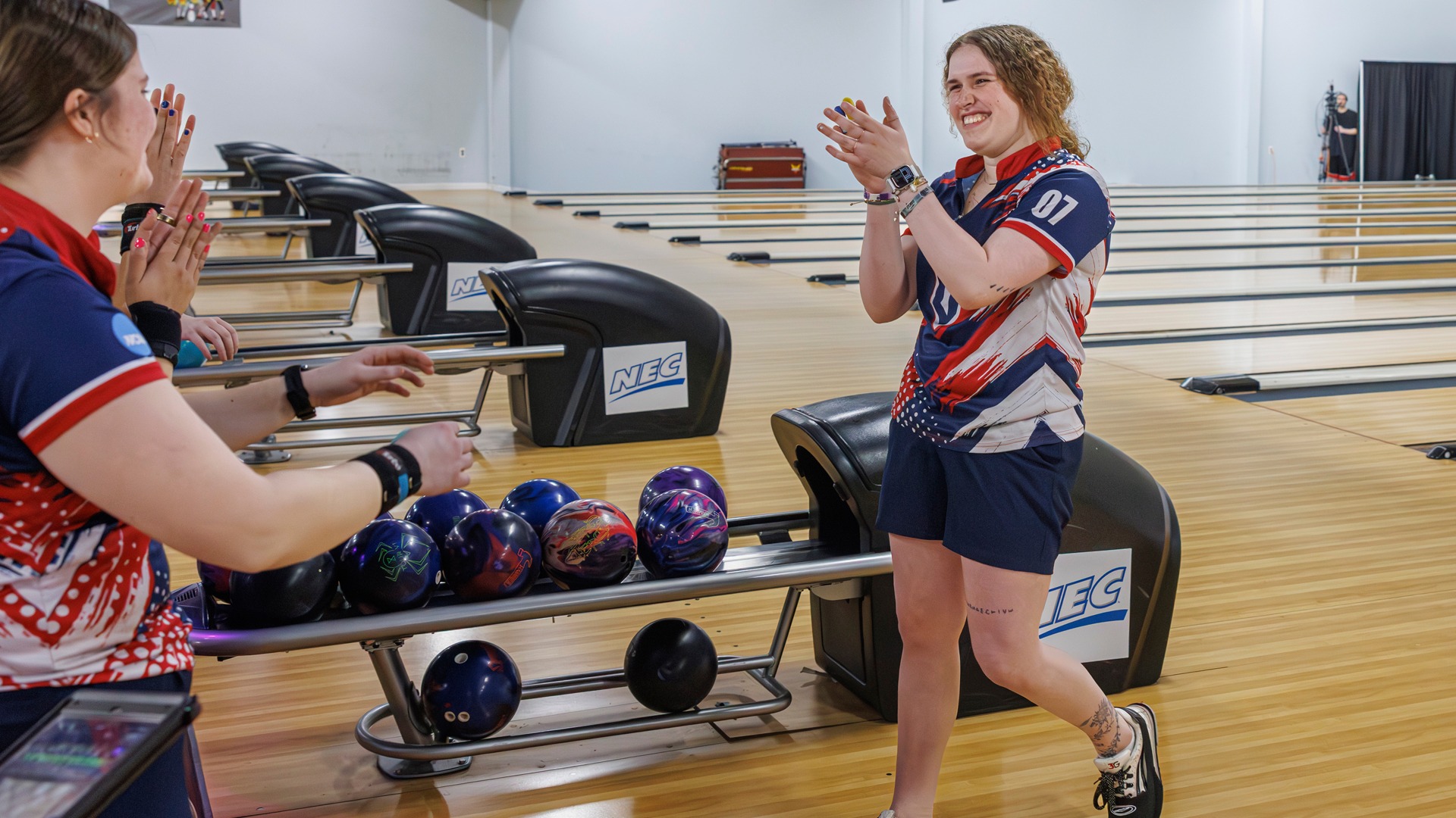 Maribeth Baker celebrates with teammates at the 2026 NEC Championship.