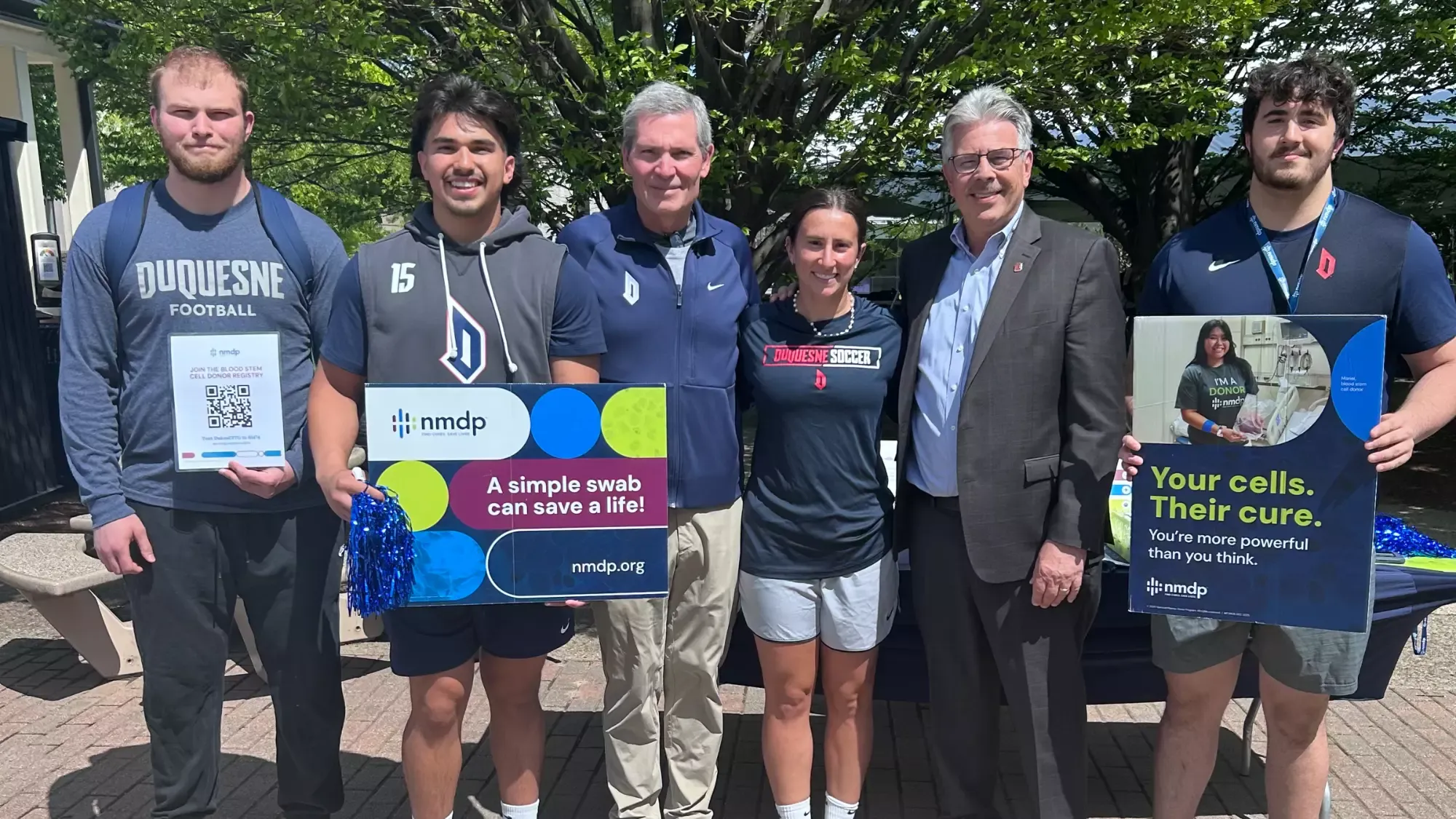 group photo with coach schmitt, president gormley, bella defabo at 2026 bone marrow drive