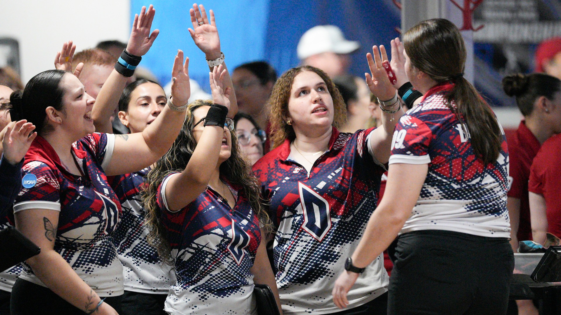 Emma Siekierski receives congratulations from teammates at AMF Mt. Lebanon Lanes.