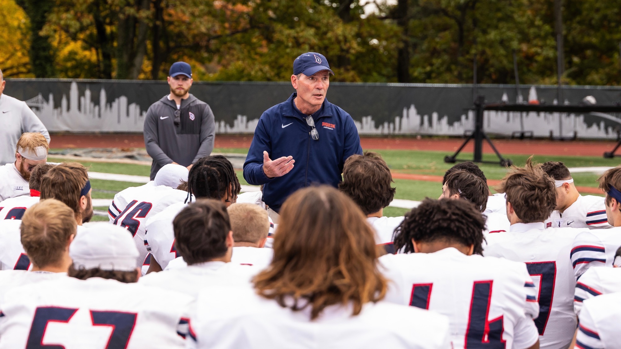 Coach Schmitt talks to team at Wagner 2025