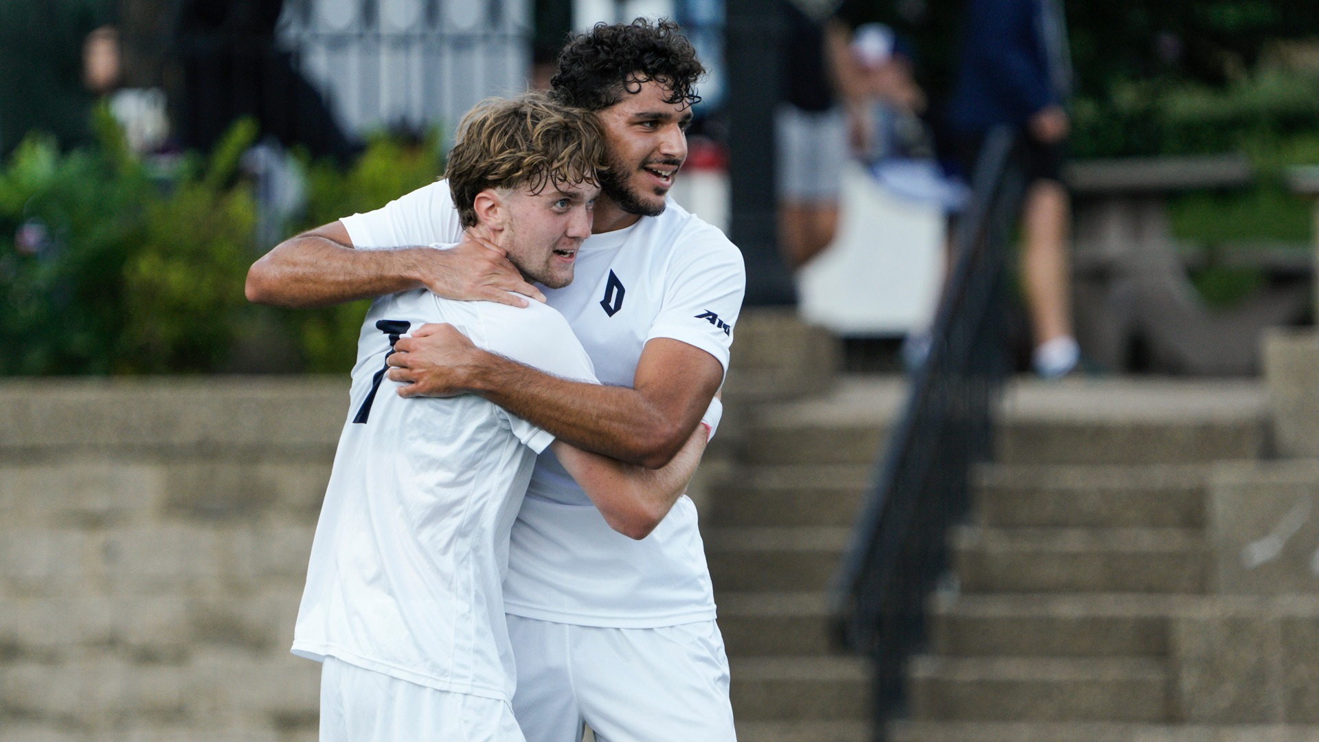 Ofek Sasson, Hakon Dagur Matthiasson embrace after a Duquesne goal at Rooney Field.