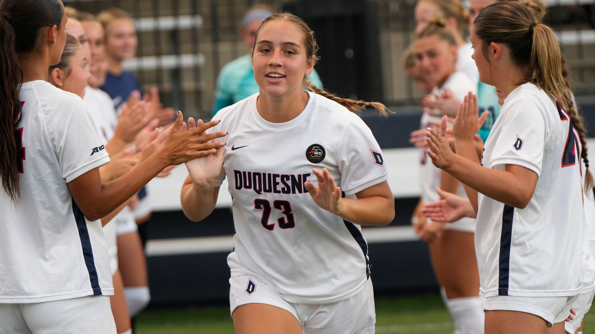 Claire Beasley during starting lineups vs. Akron in 2026 home opener at Rooney Field.