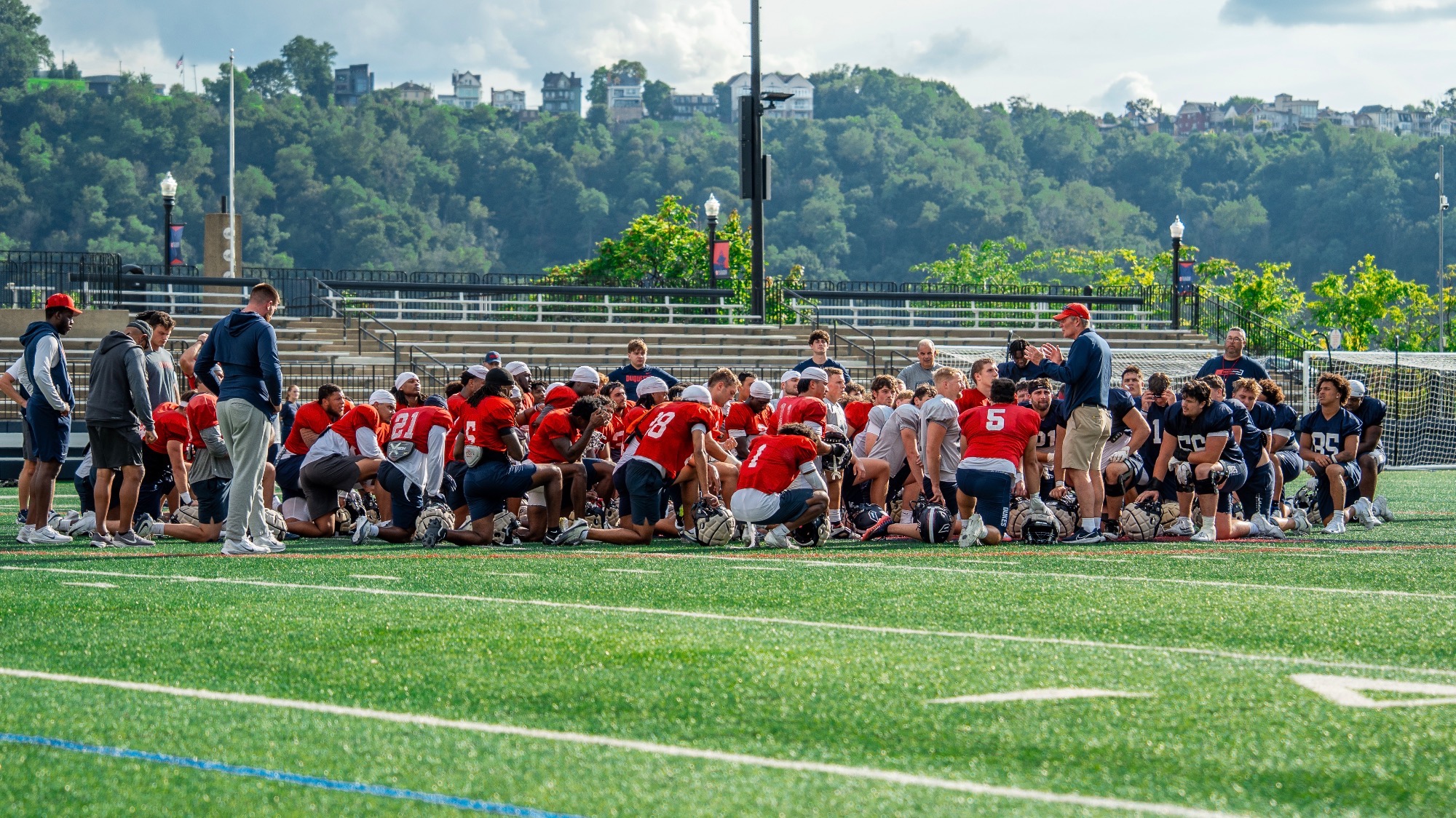 Football team huddle after practice