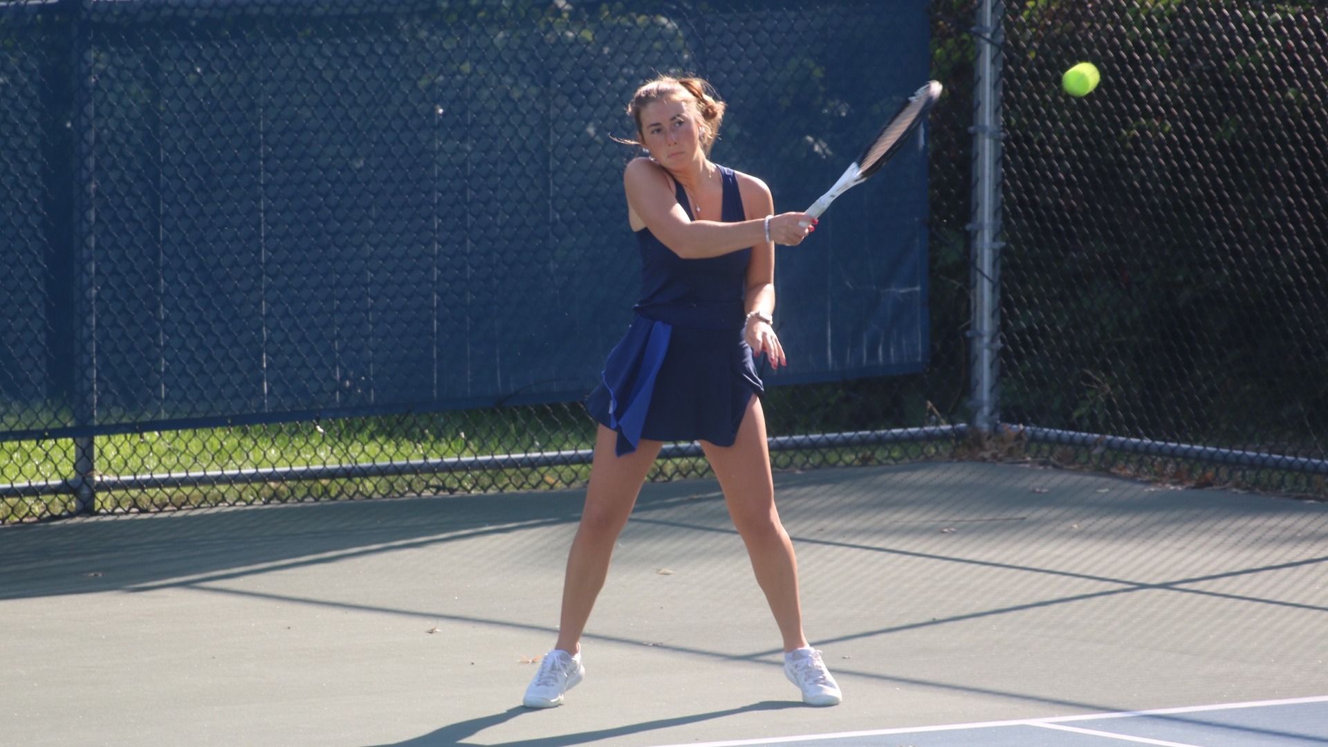 Katie Berra hitting forehand return shot
