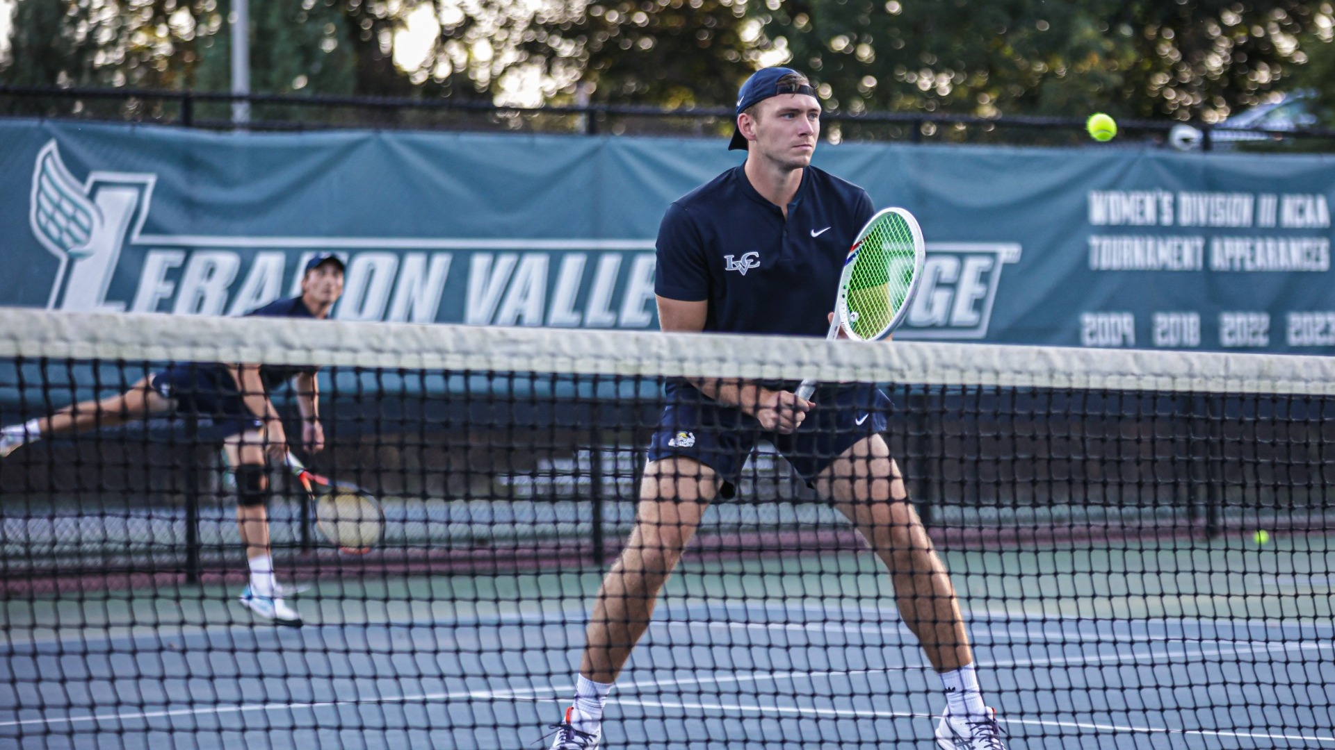 Beck at the net while Warren serves