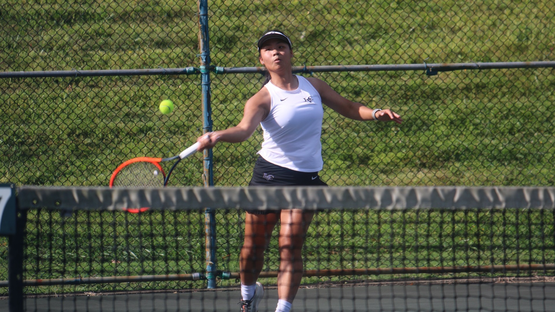 Catherine Stone hitting forehand return