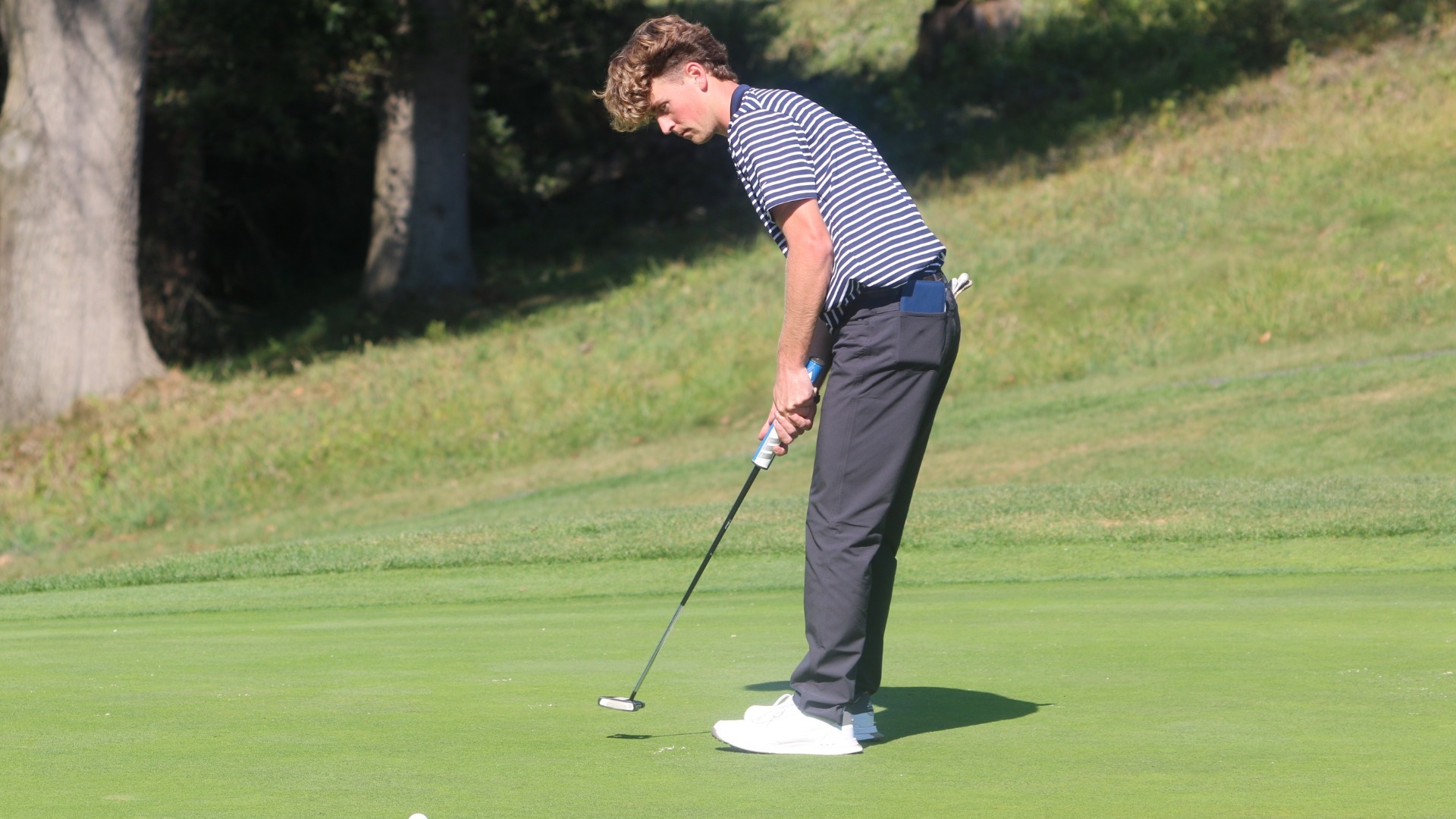 Reagan Flynn watching putt go into the hole