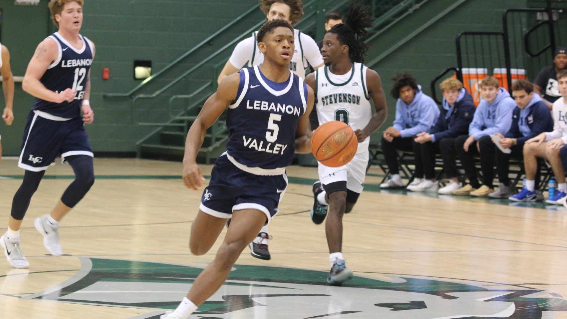 Demarcus Bandy dribbling to the hoop after steal