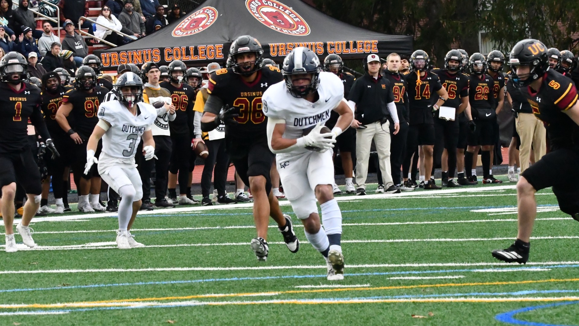 Tommy Delgado running with ball for touchdown reception