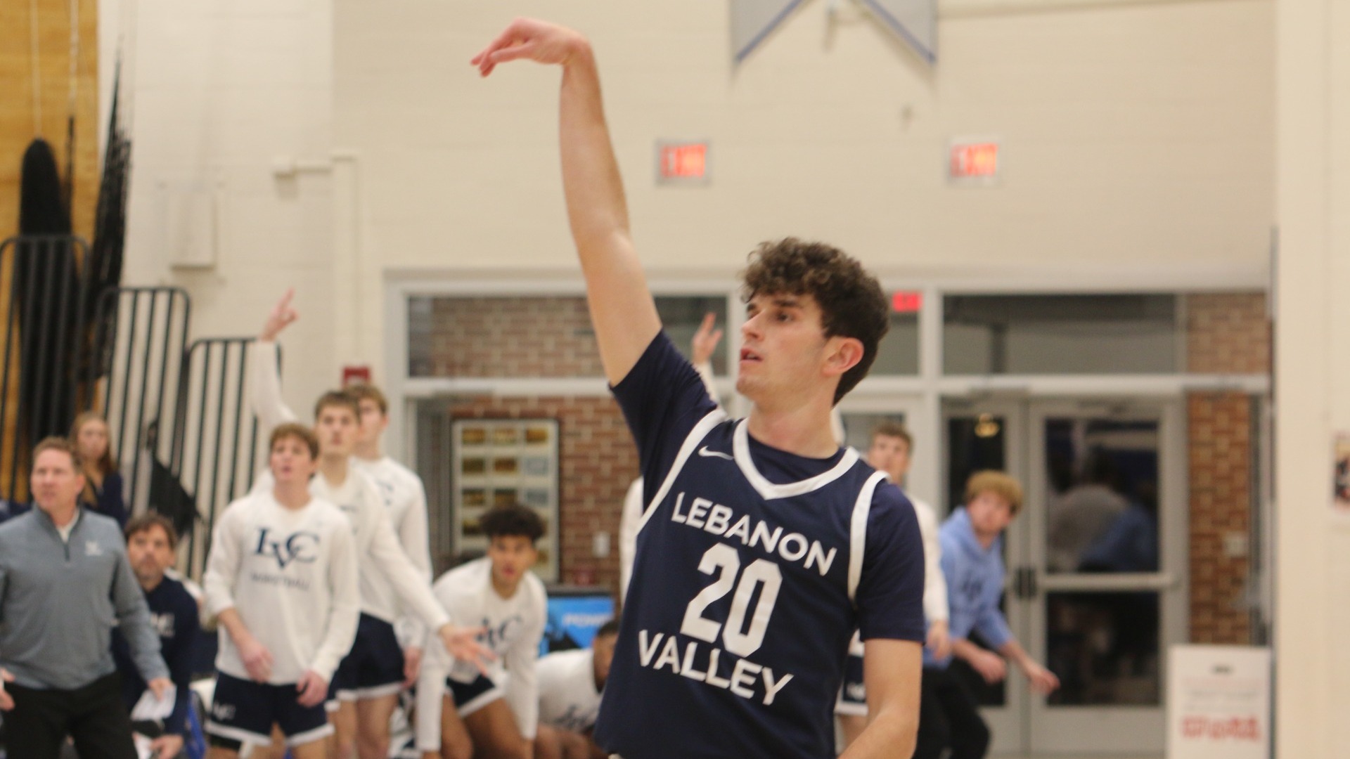 Reed Melvin watching three-pointer go in
