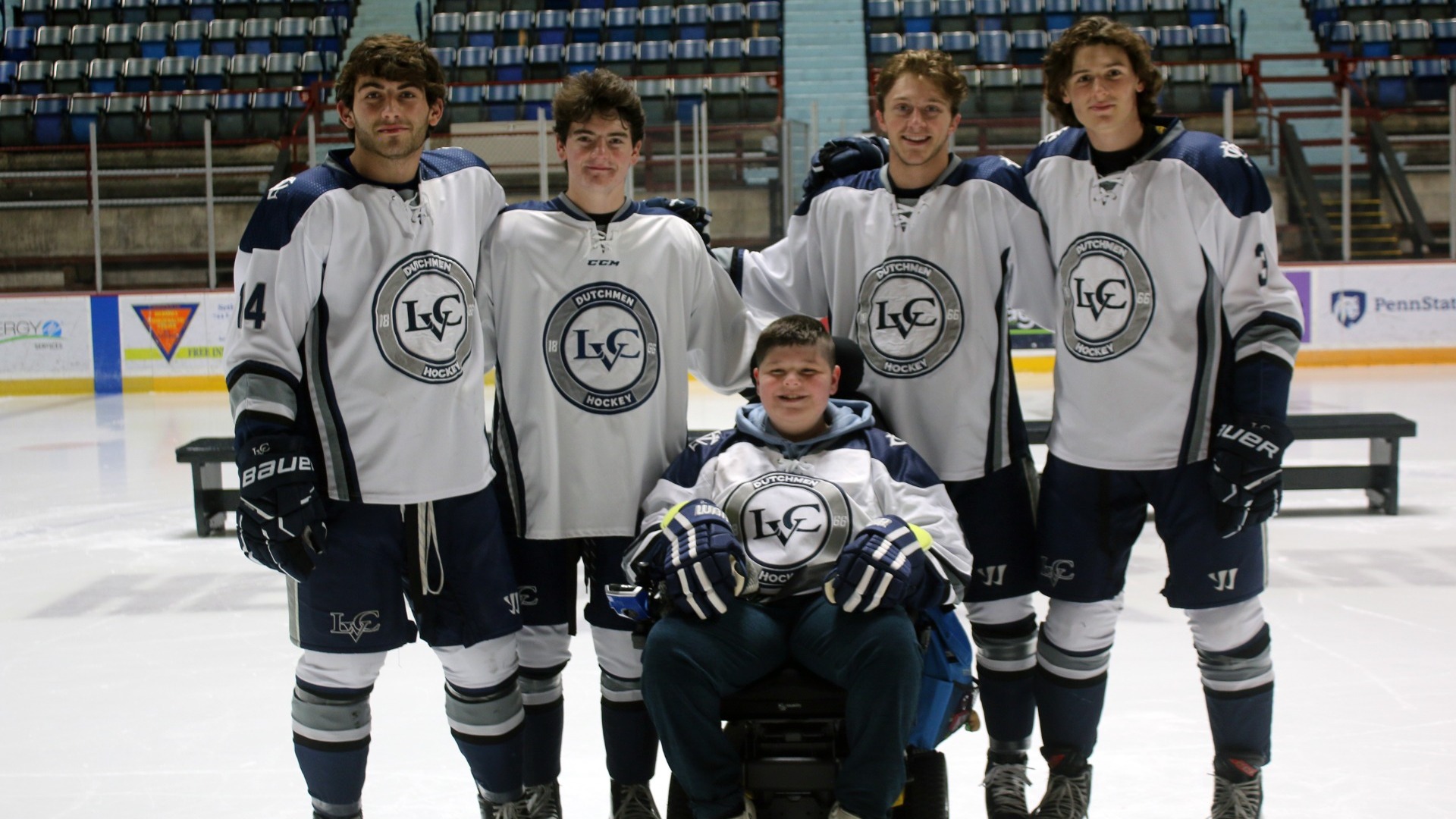 Men's Hockey players with Jamie Reynolds