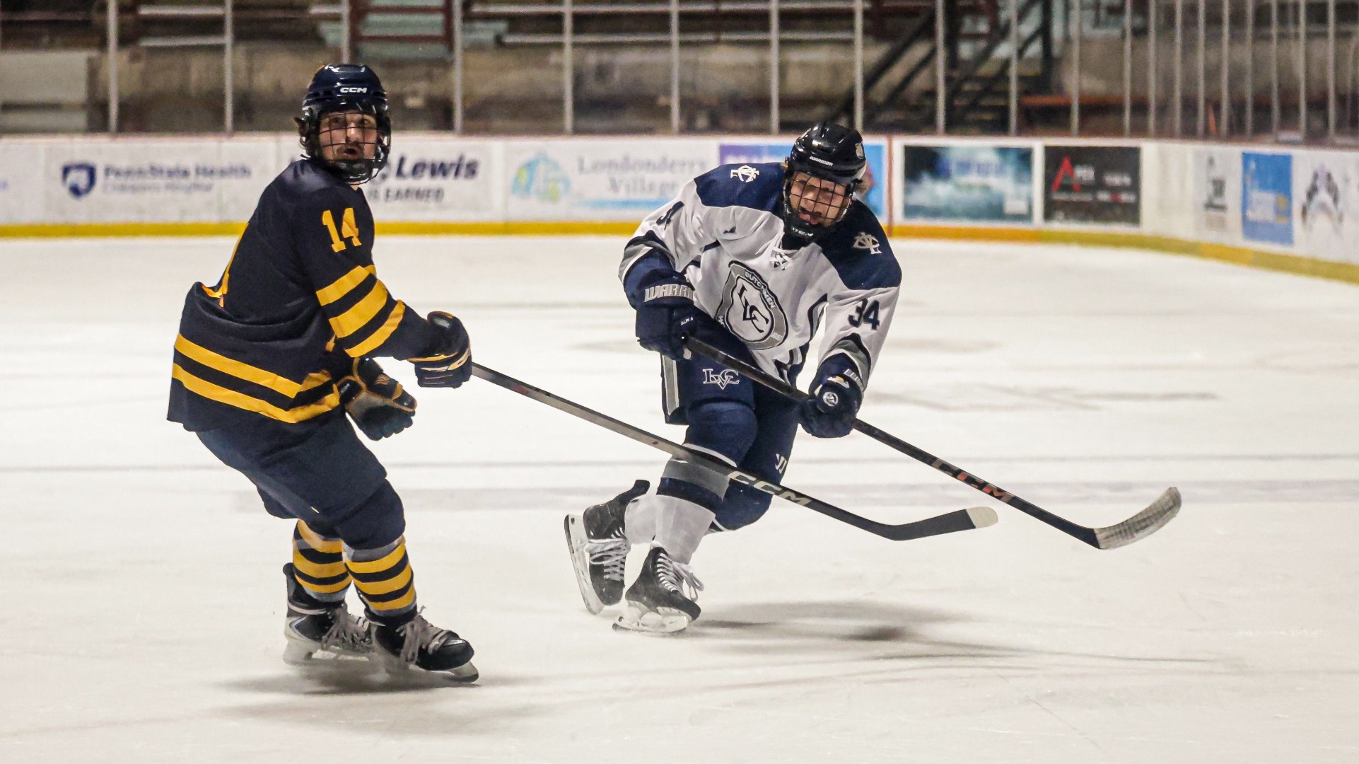 Cade Helmer passes the puck